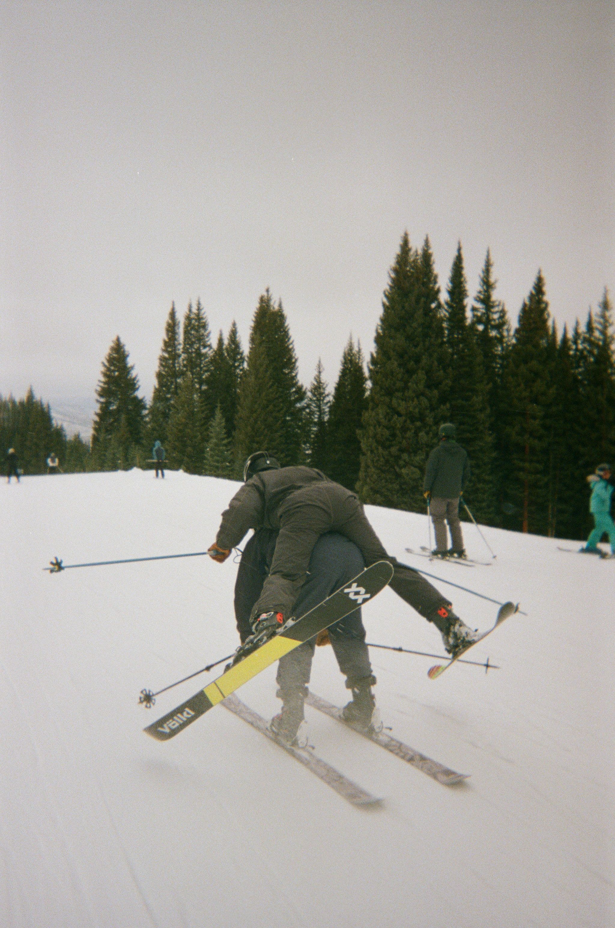 An image of people goofing off on a ski hill 