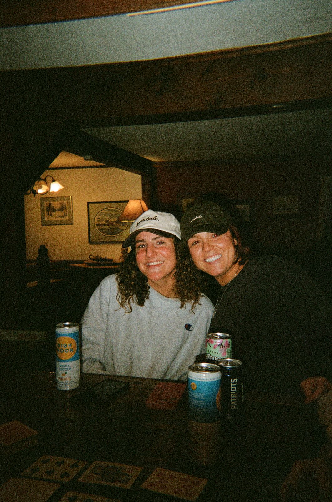An image of people smiling with hats on