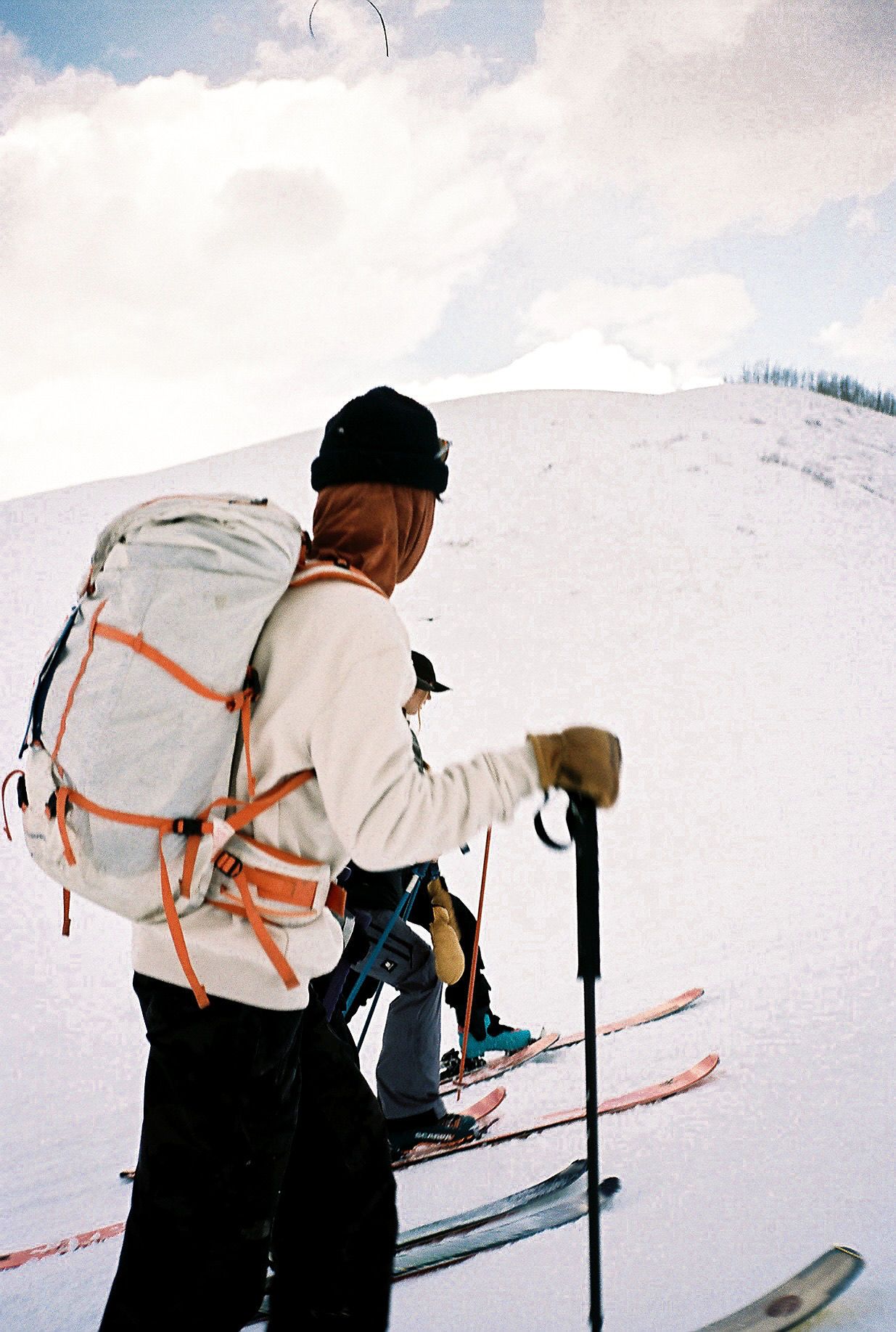 An image of a man skiing with a backpack in the backcountry