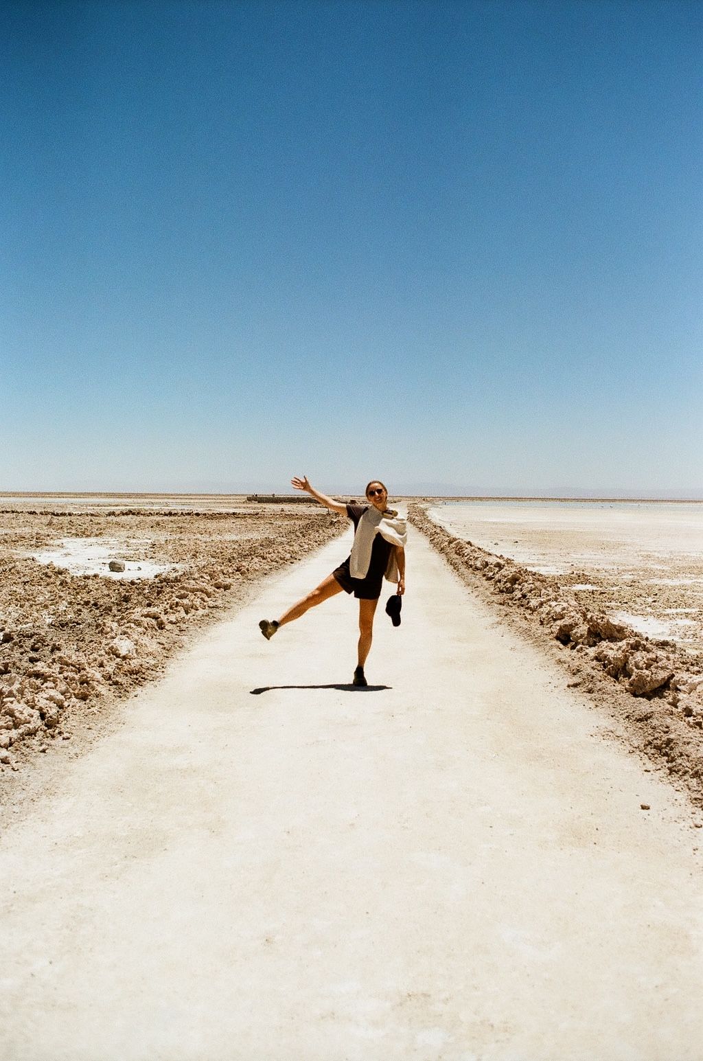 An image a of a person walking in the desert