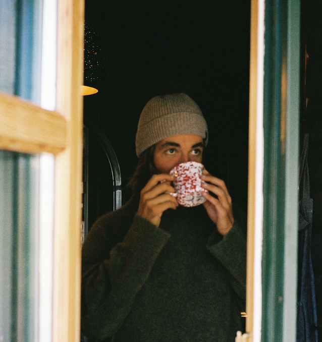 A man sipping a cup of coffee