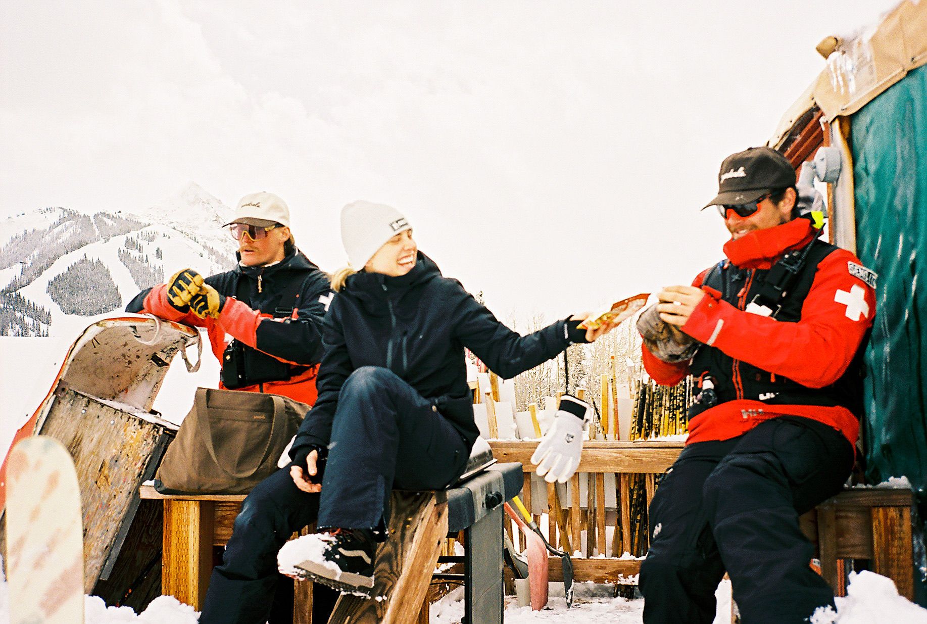 Photo of ski patrollers eating candy