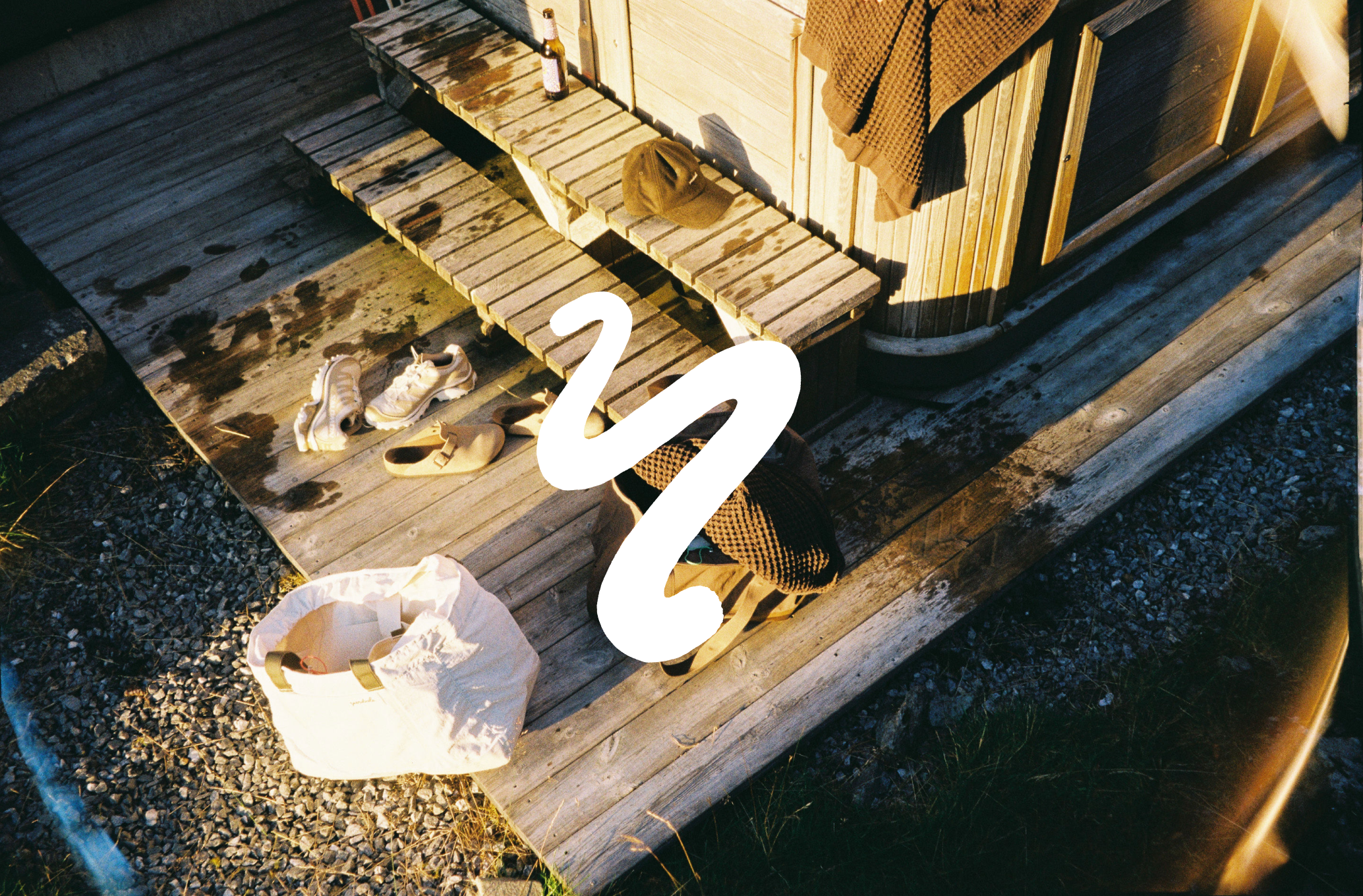 An image a of a hot tub with towels and bags nearby
