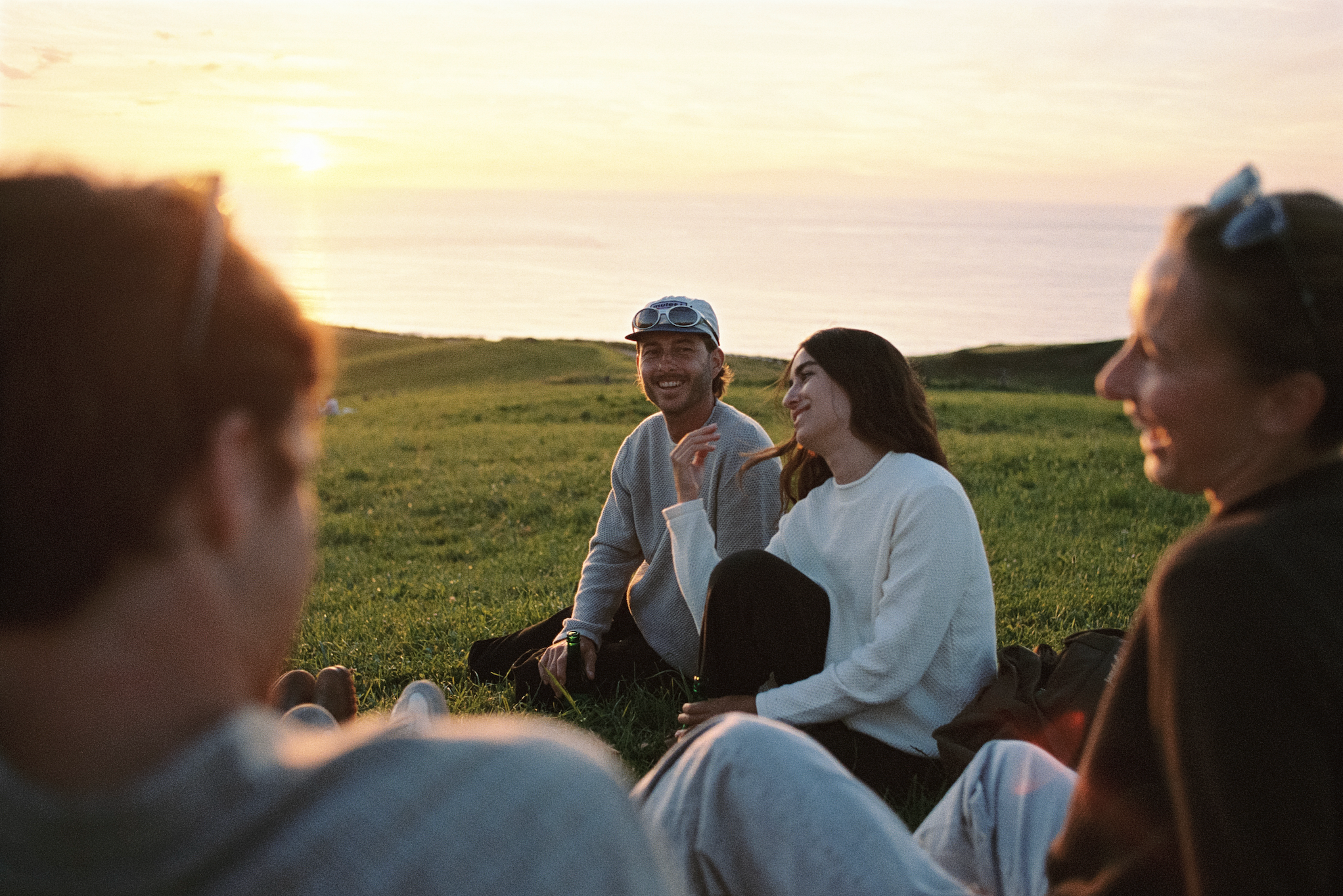 An image of a couple in cotton surf sweaters