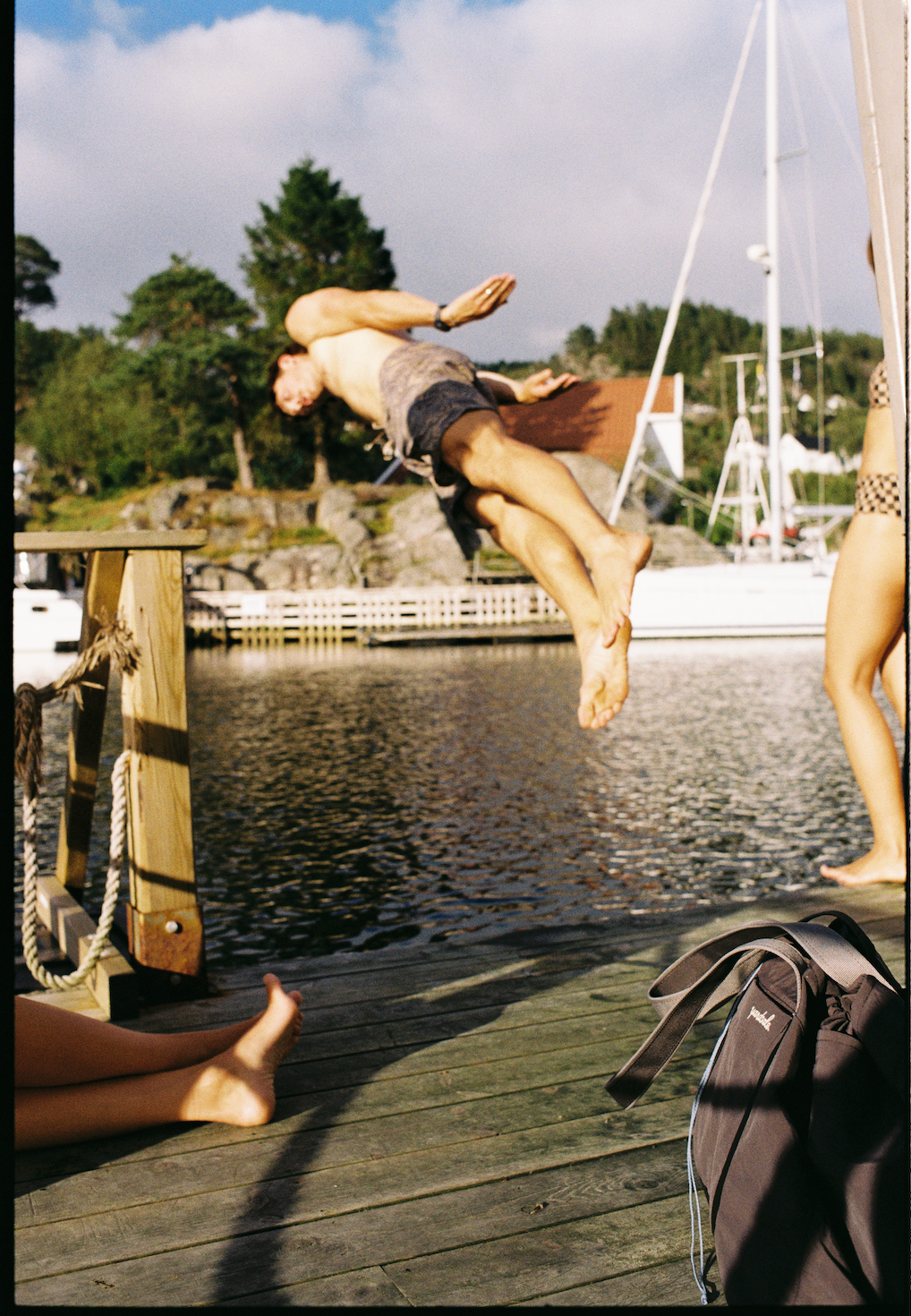 Image of a person jumping off a dock