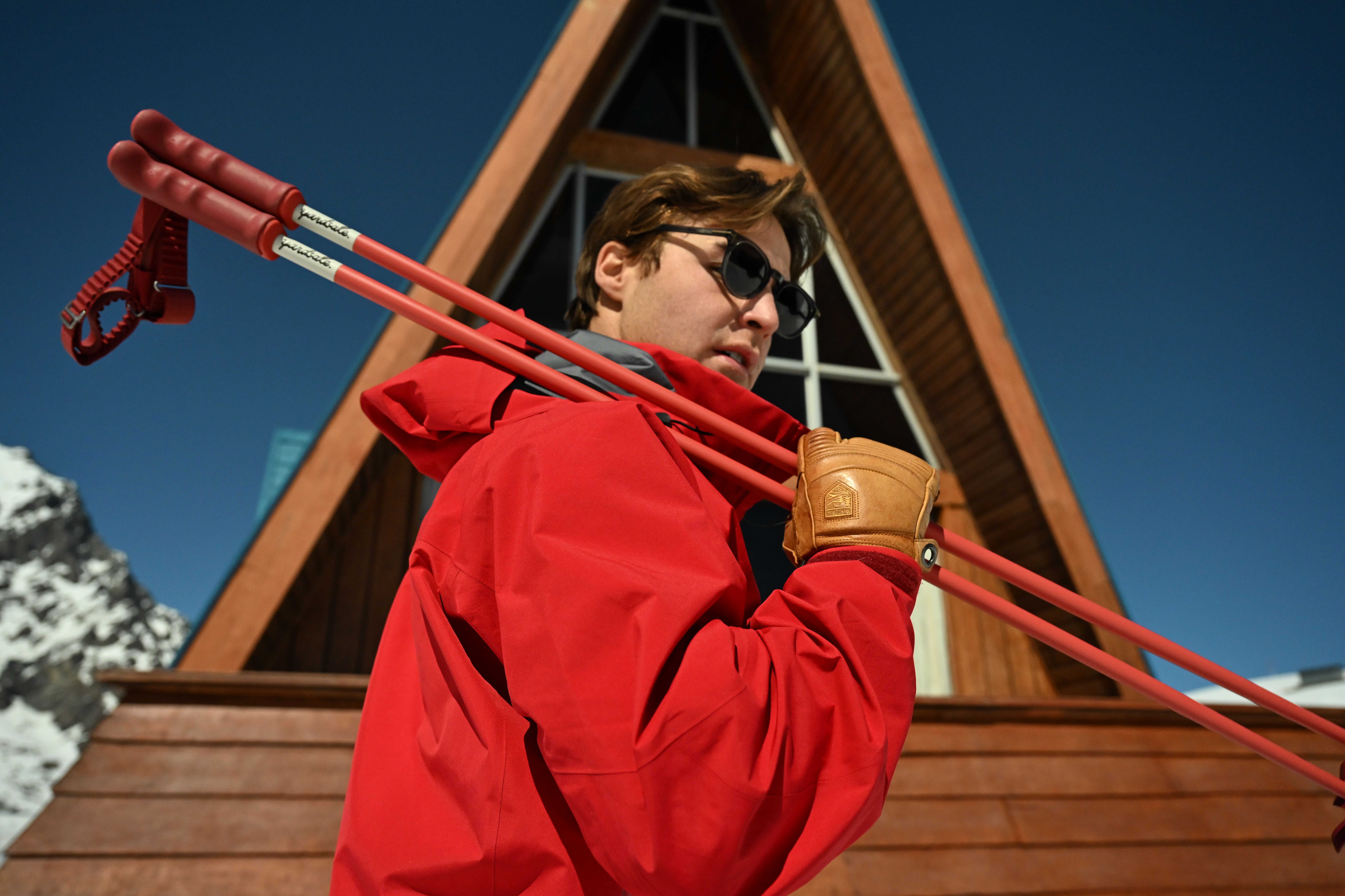 An image of a man carrying Yardsale ski poles 