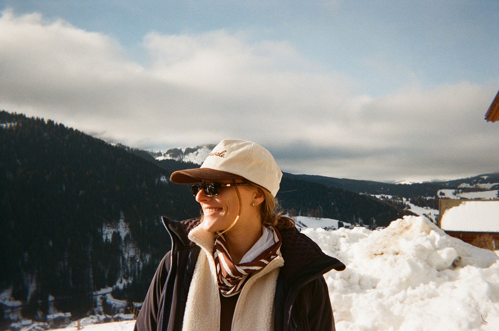 An image a of a person smiling in a Yardsale hat