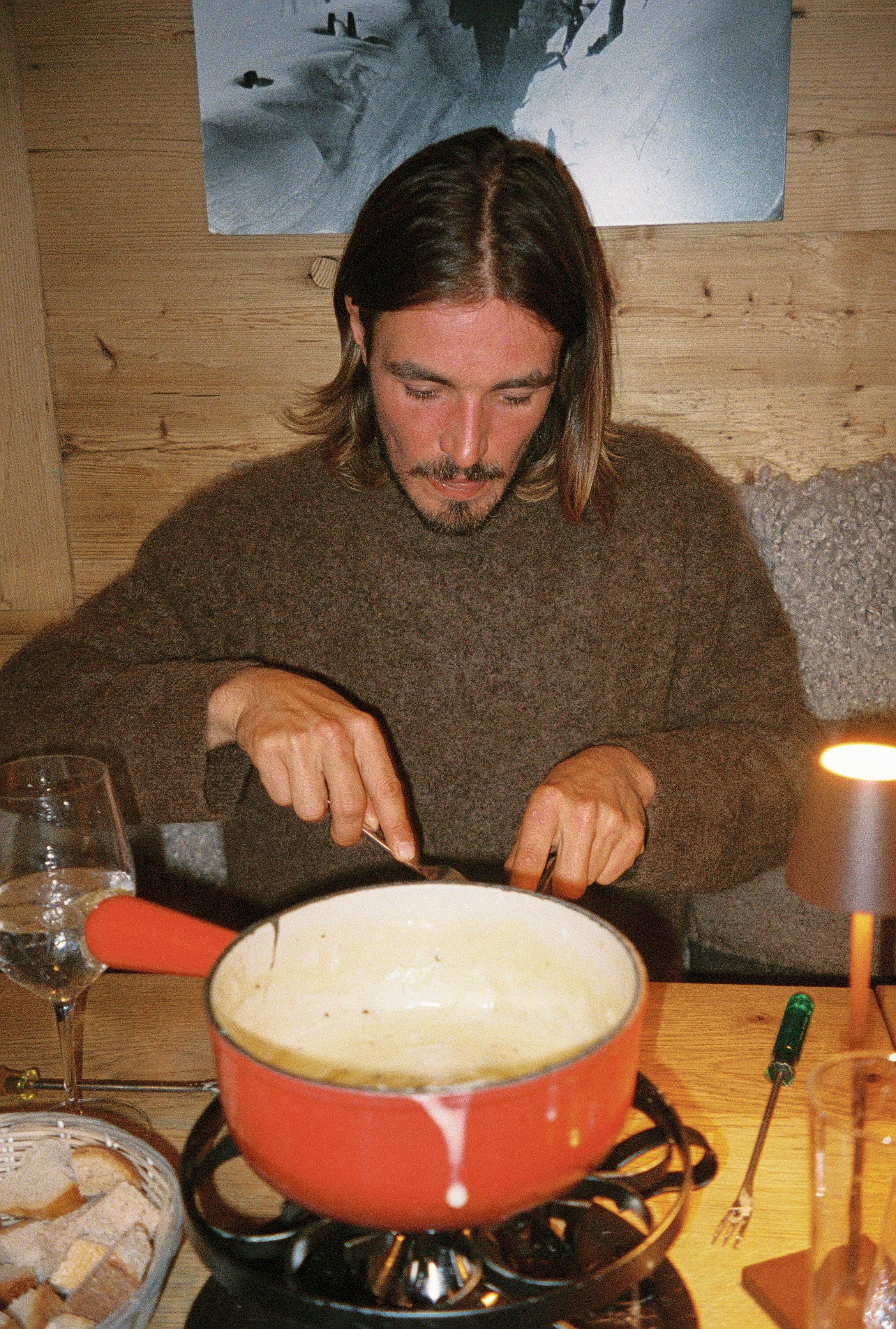 An image of a man having dinner in a Dinner Sweater