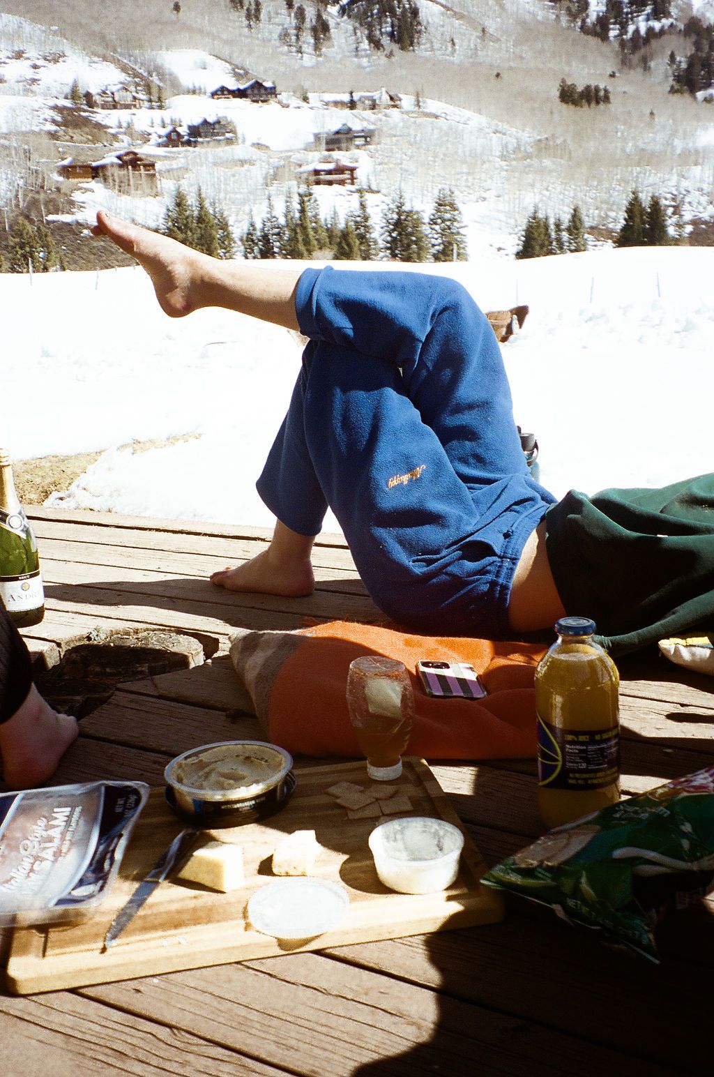 An image of a person relaxing on a deck