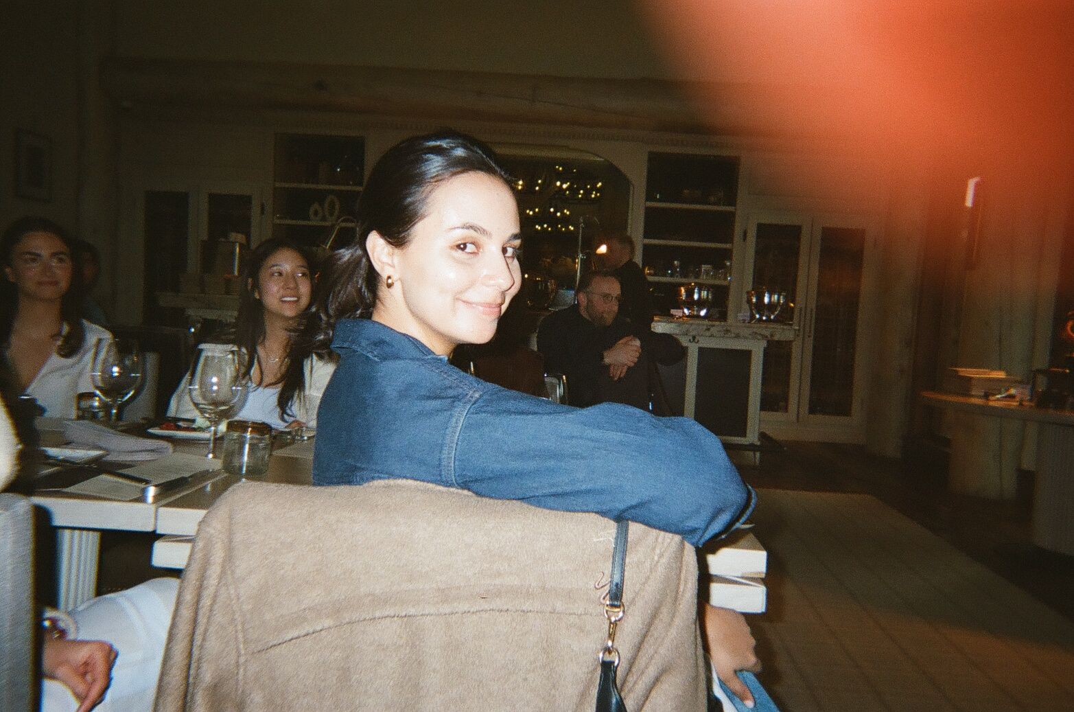 An image of a woman sitting in a chair