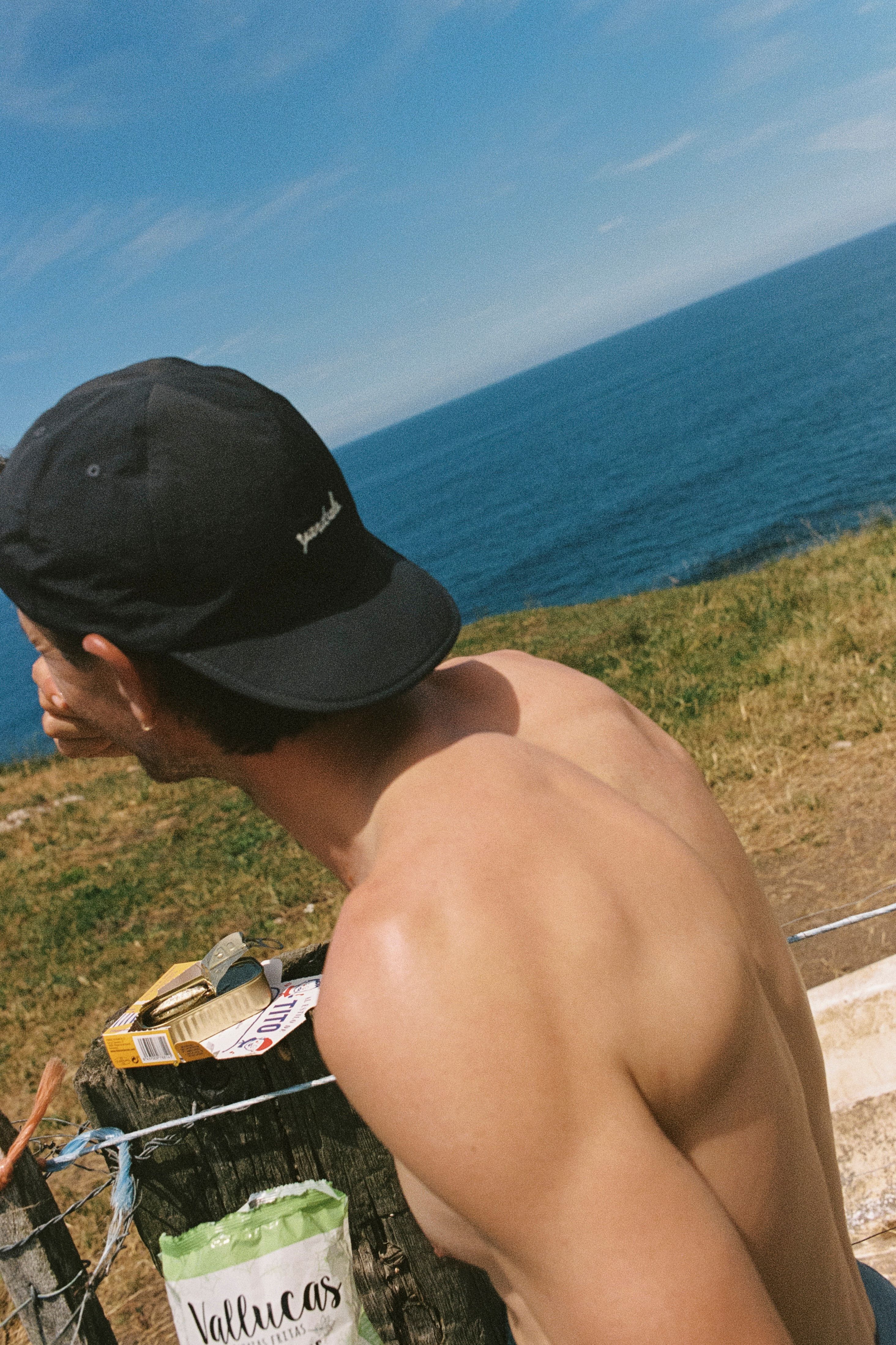 Image of man wearing a backwards Day Hat