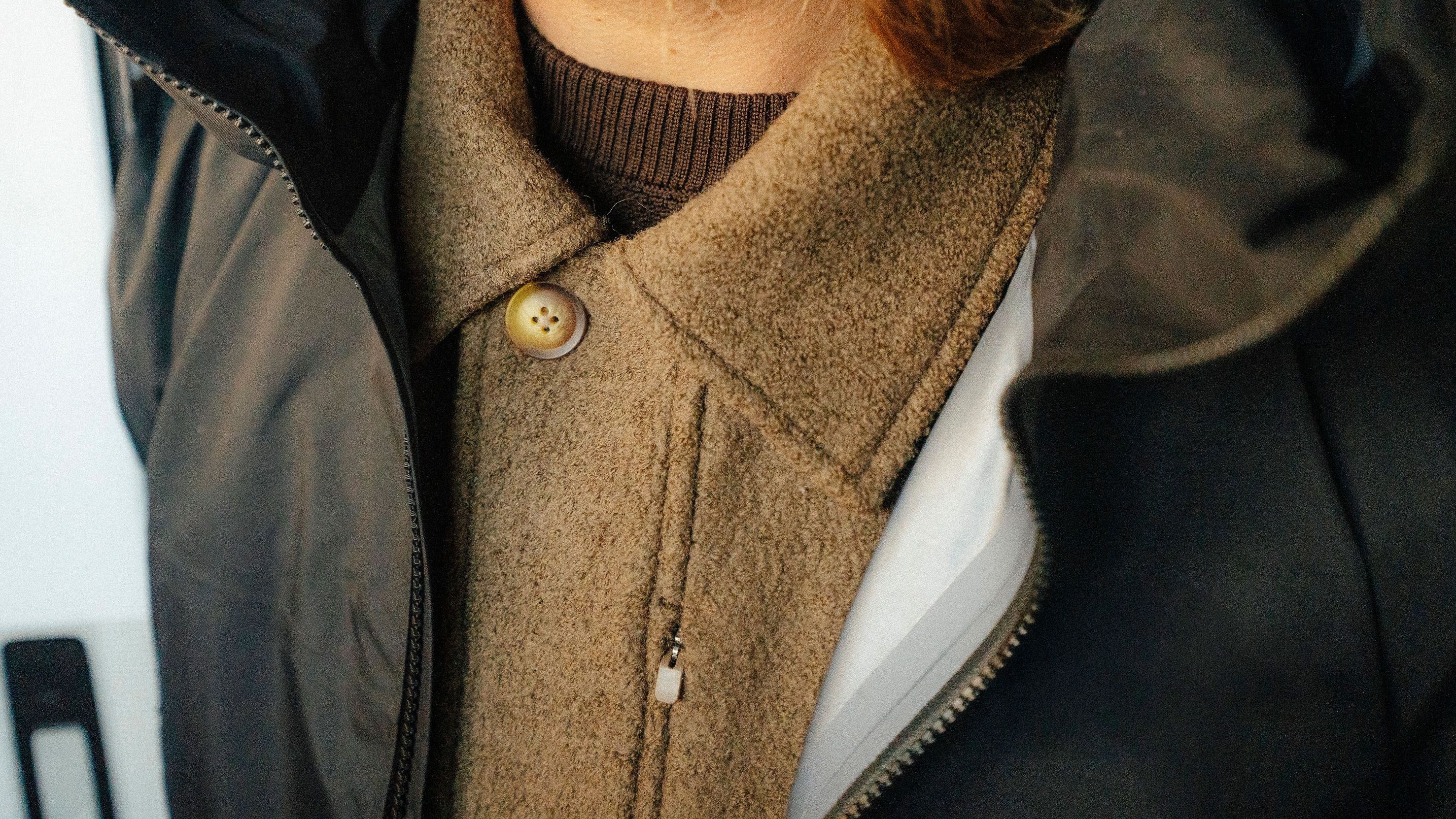 Closeup of sport coat under women's jacket