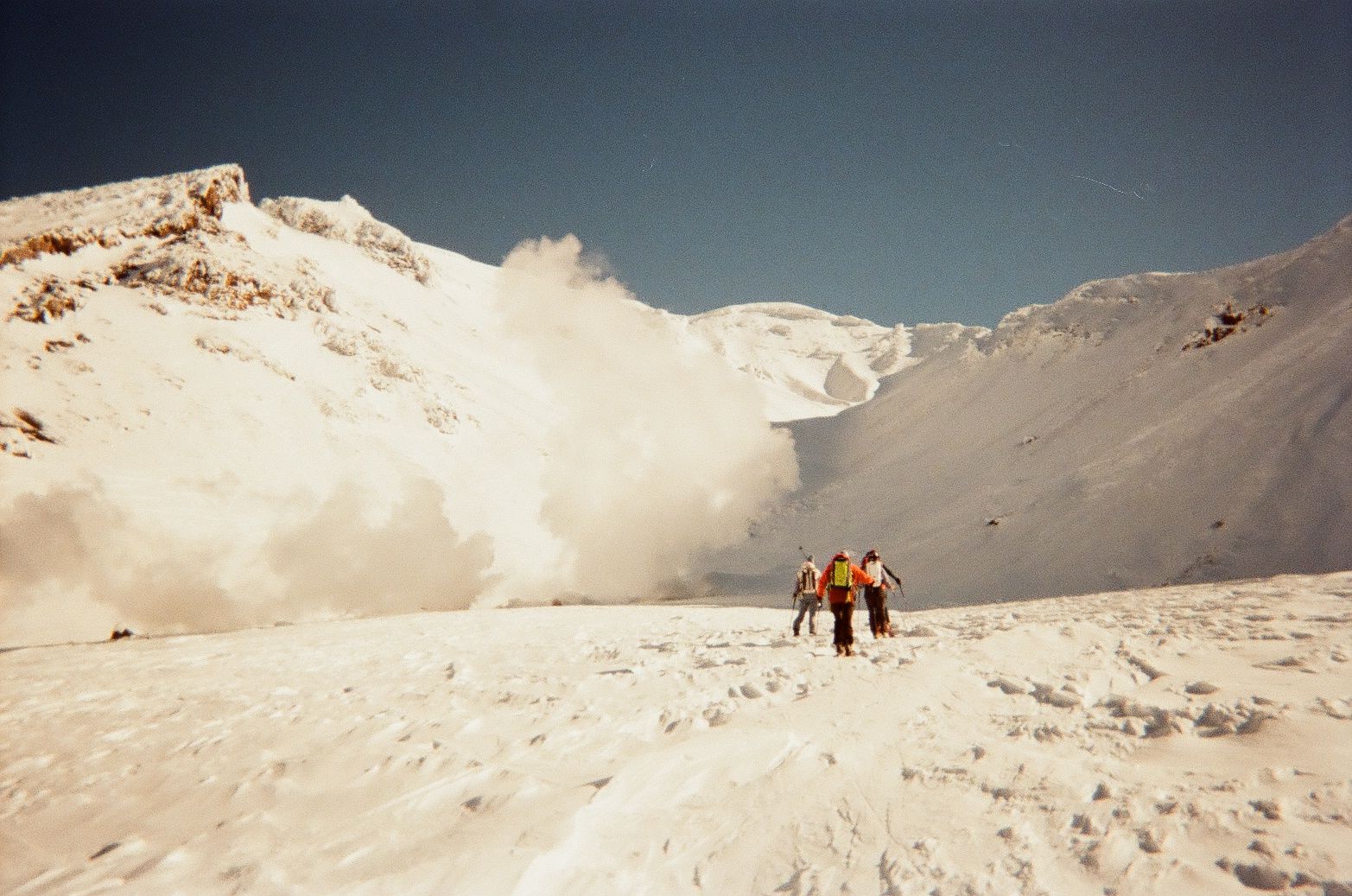 An image of a group of people walking on a snowy mountain