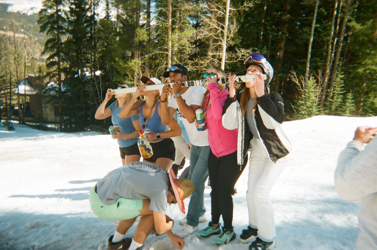 An image of friends doing a shotski in Colorado 