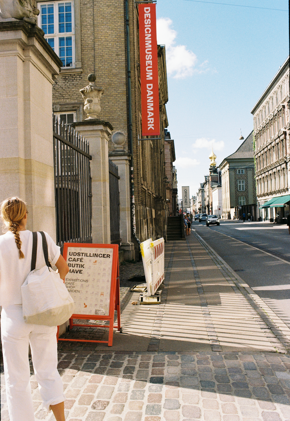 Image of someone standing outside a museum
