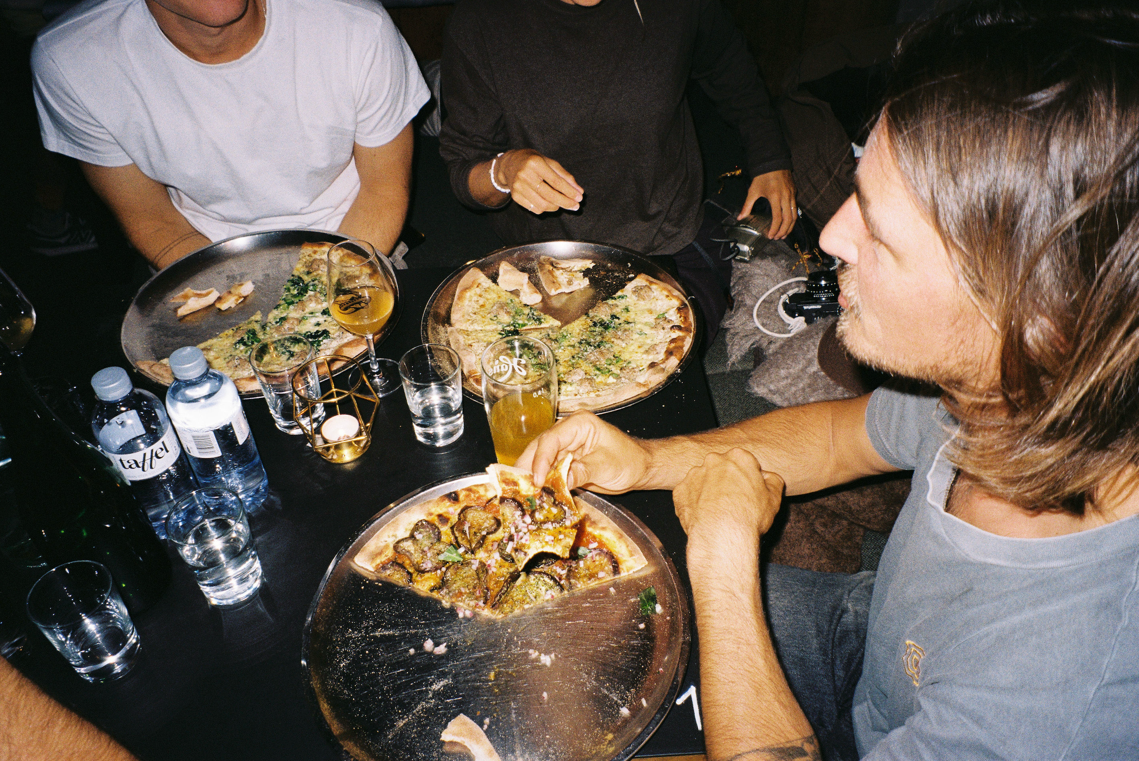 Photo of people eating pizza