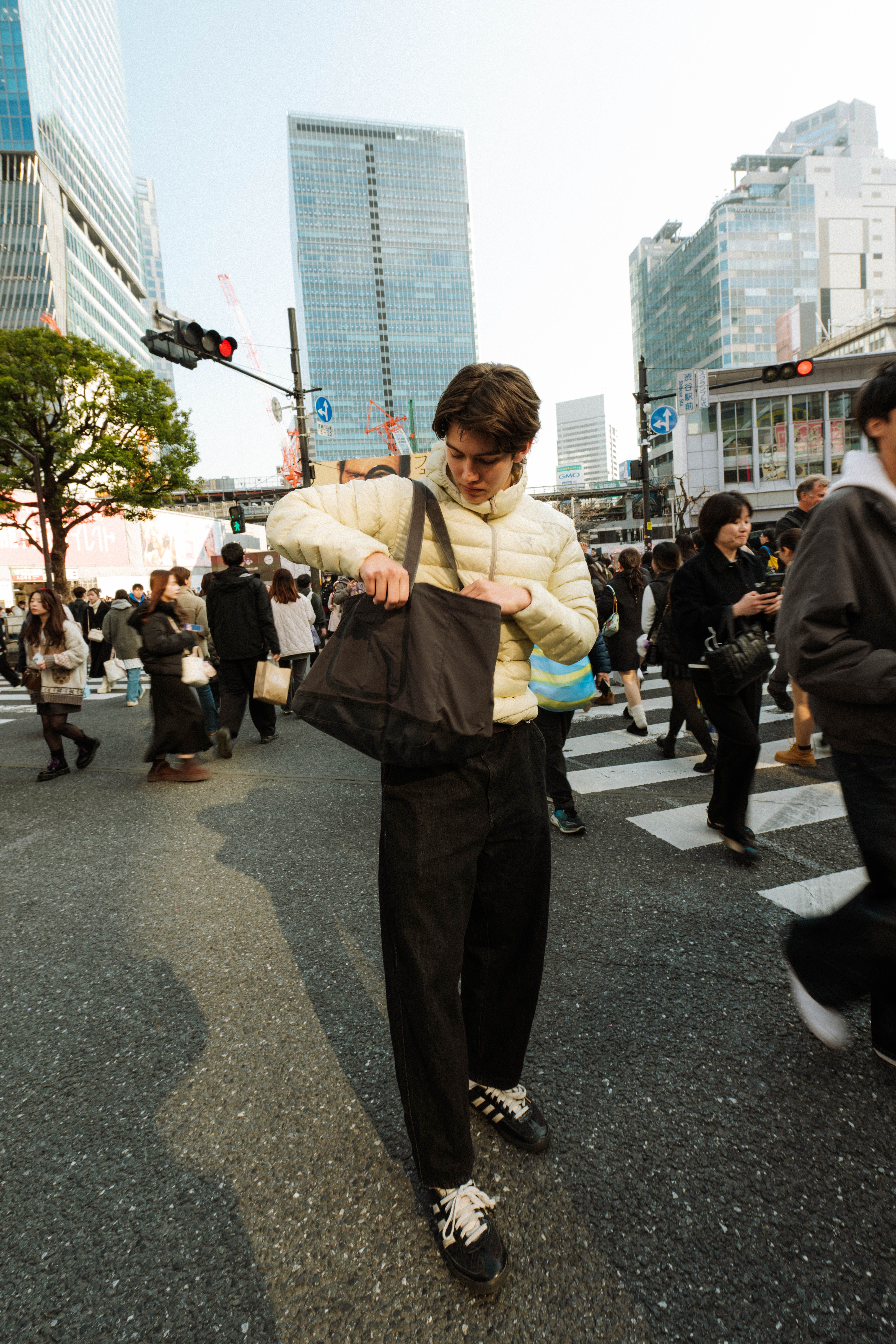 An image of a man at Shibuya Crossing in Tokyo