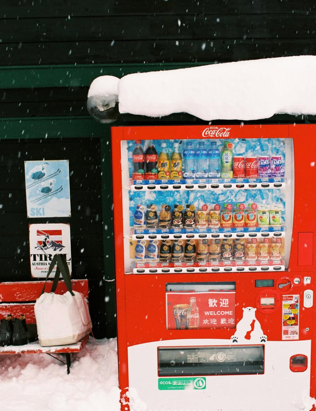 An image a of a vending machine in the snow