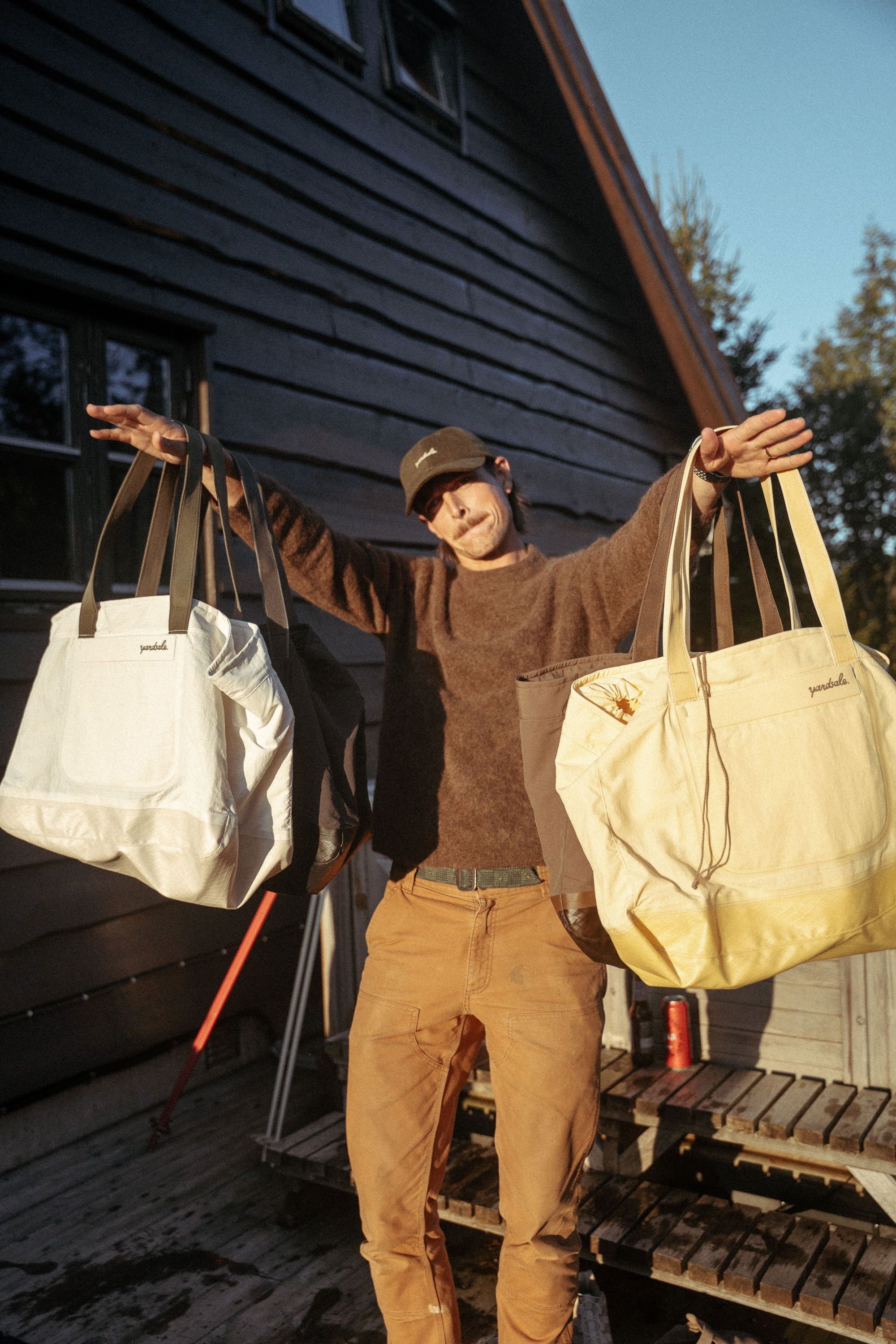An image a of a person holding day bags on their arm