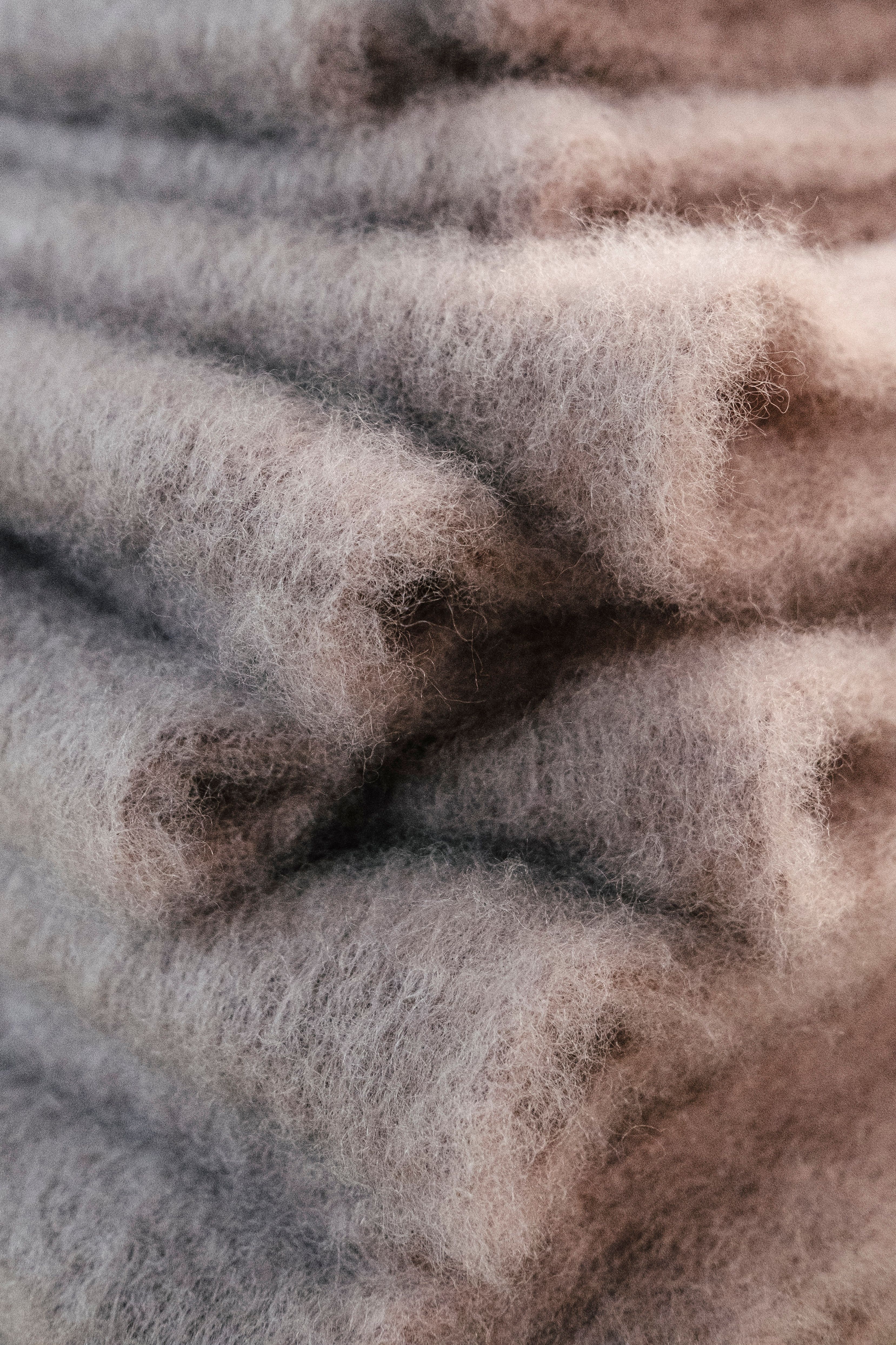 An image of multiple scarves stacked on top of each other