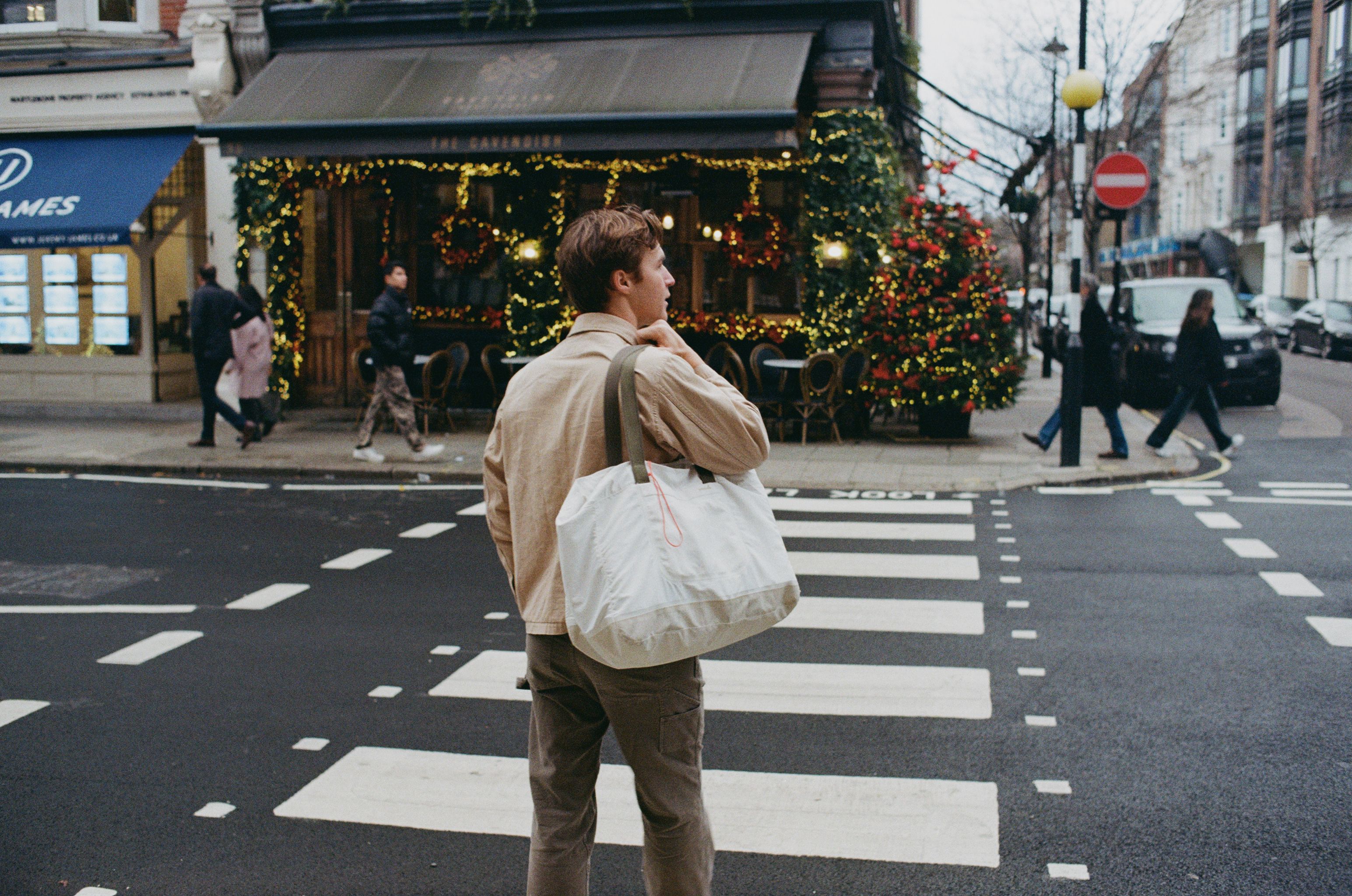 An image a of a person walking across the street in London