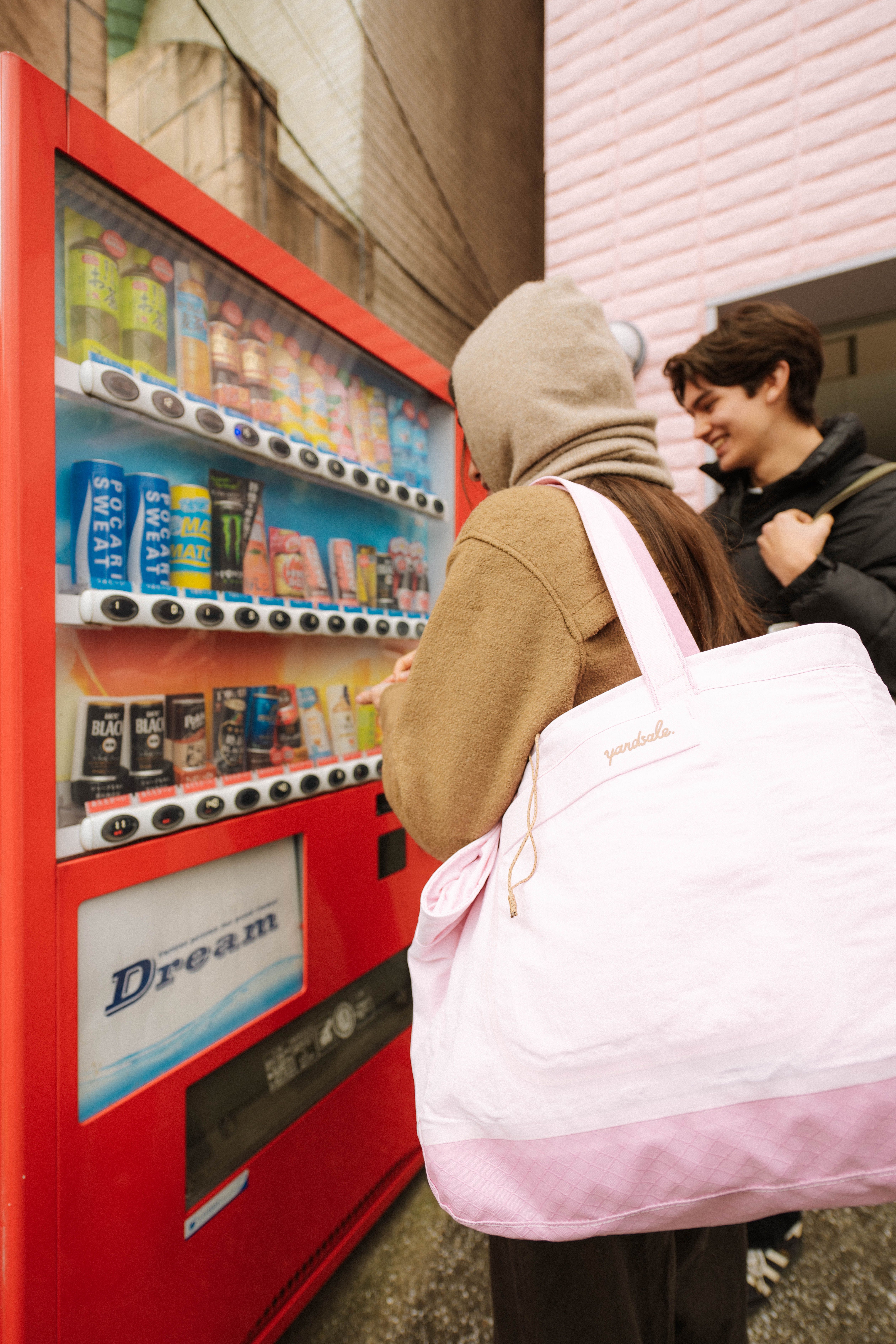 Image of a person using a vending machine in Japan
