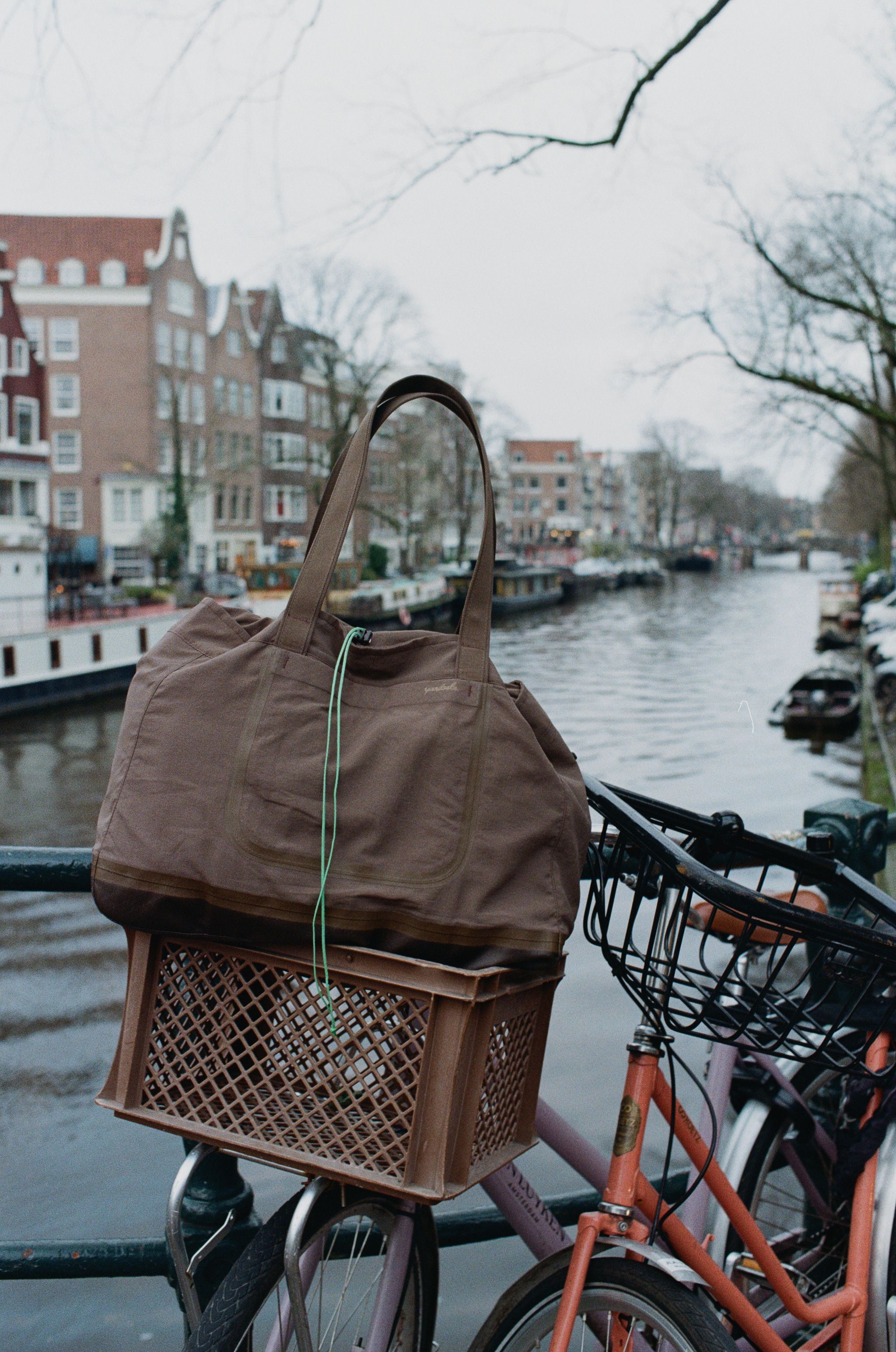 An image of a bag inside of a basket on a bicycle 