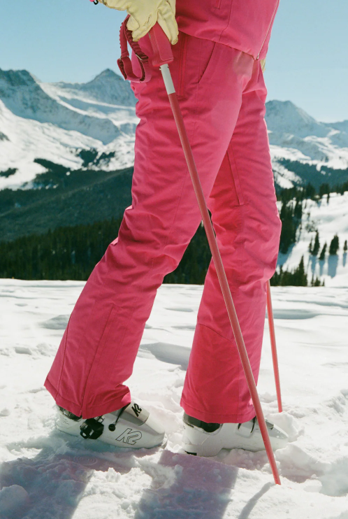 An image of skiers on a chairlift