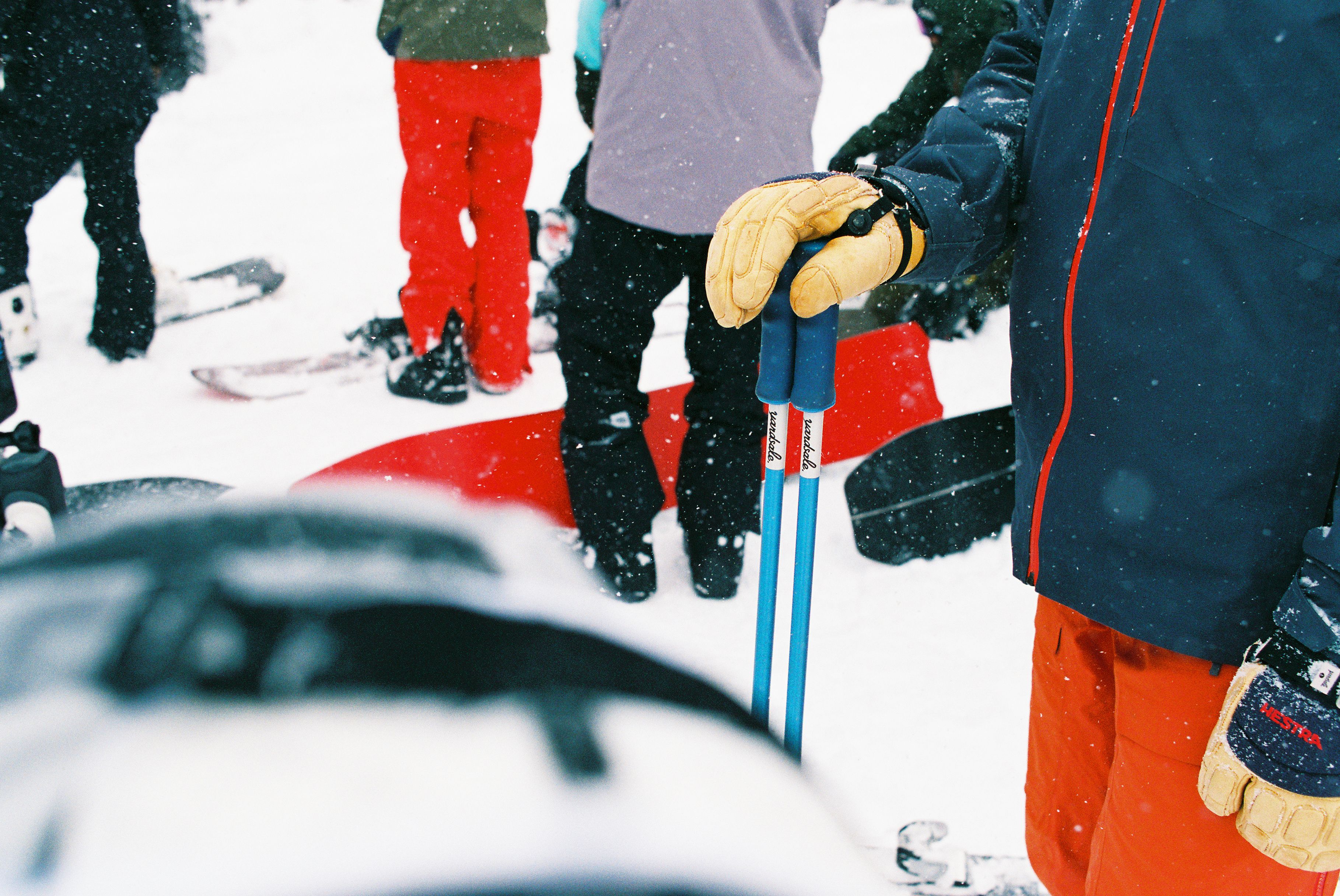 An image of a skier with ski poles in the snow