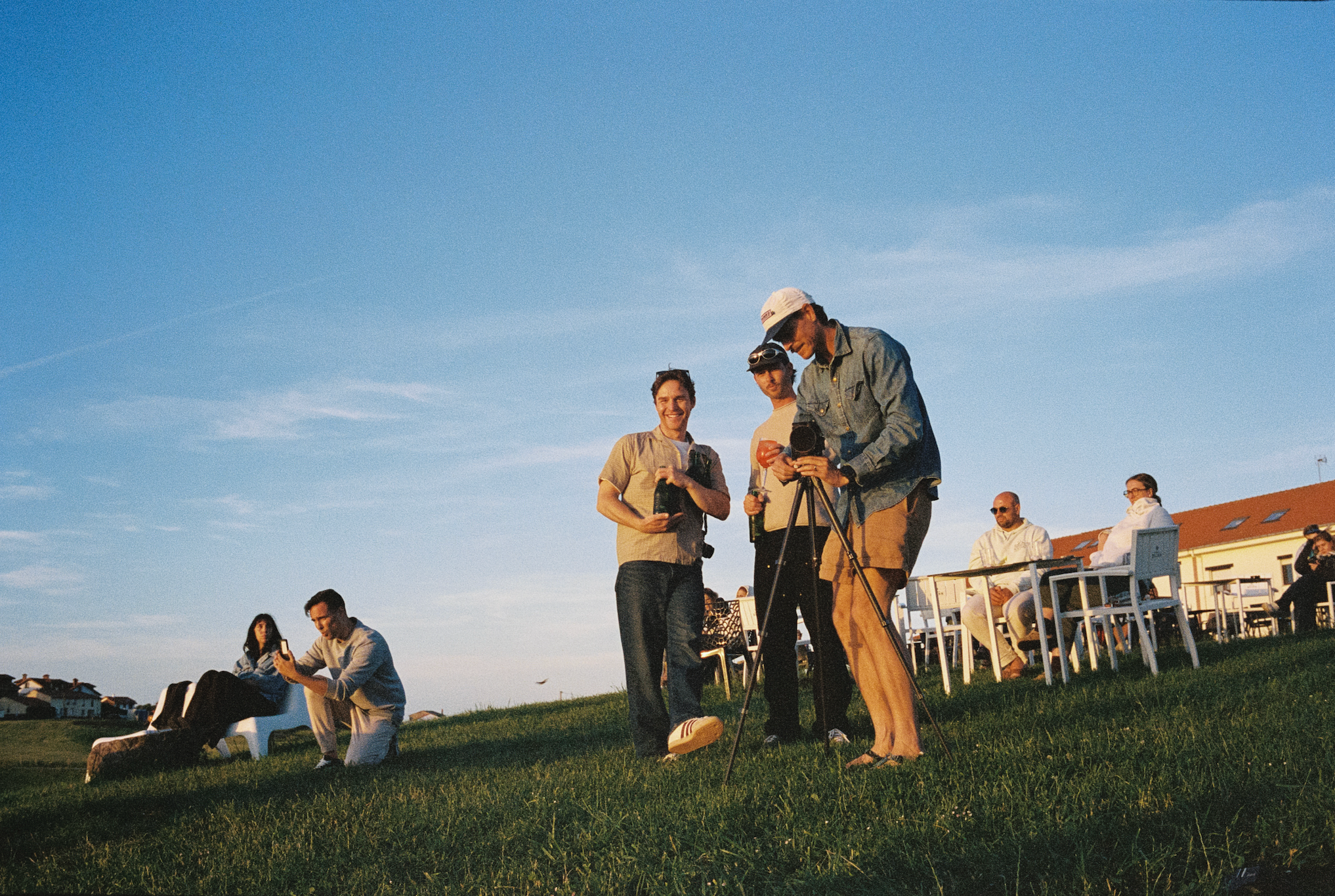 An image of people on a grassy hill