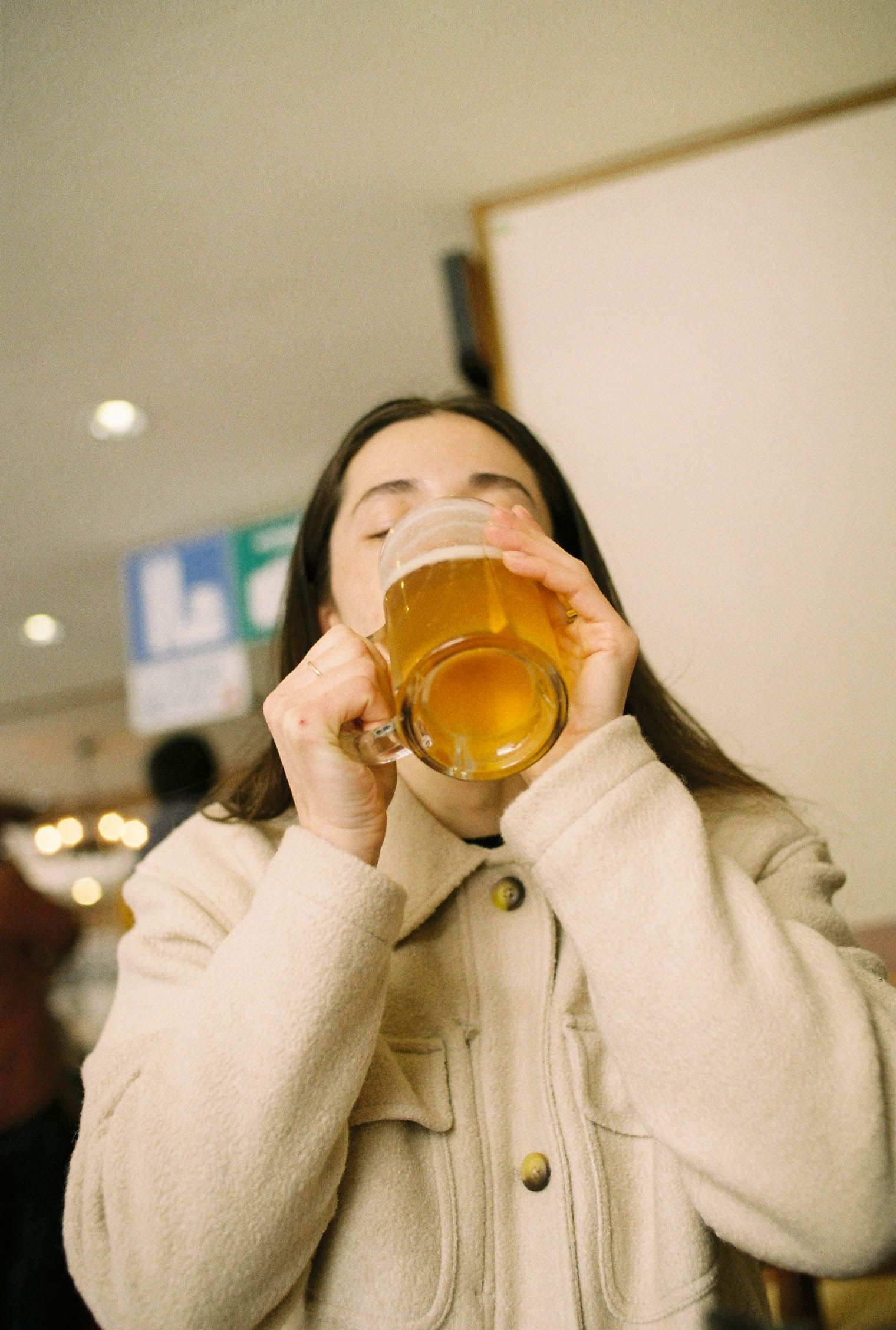 A woman drinking a Japanese beer in a Yardsale Sport Coat