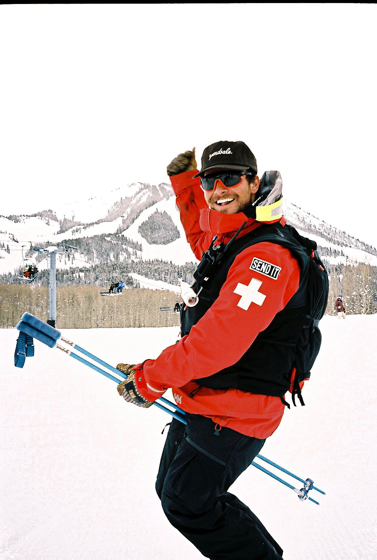 An image of skier with ski poles