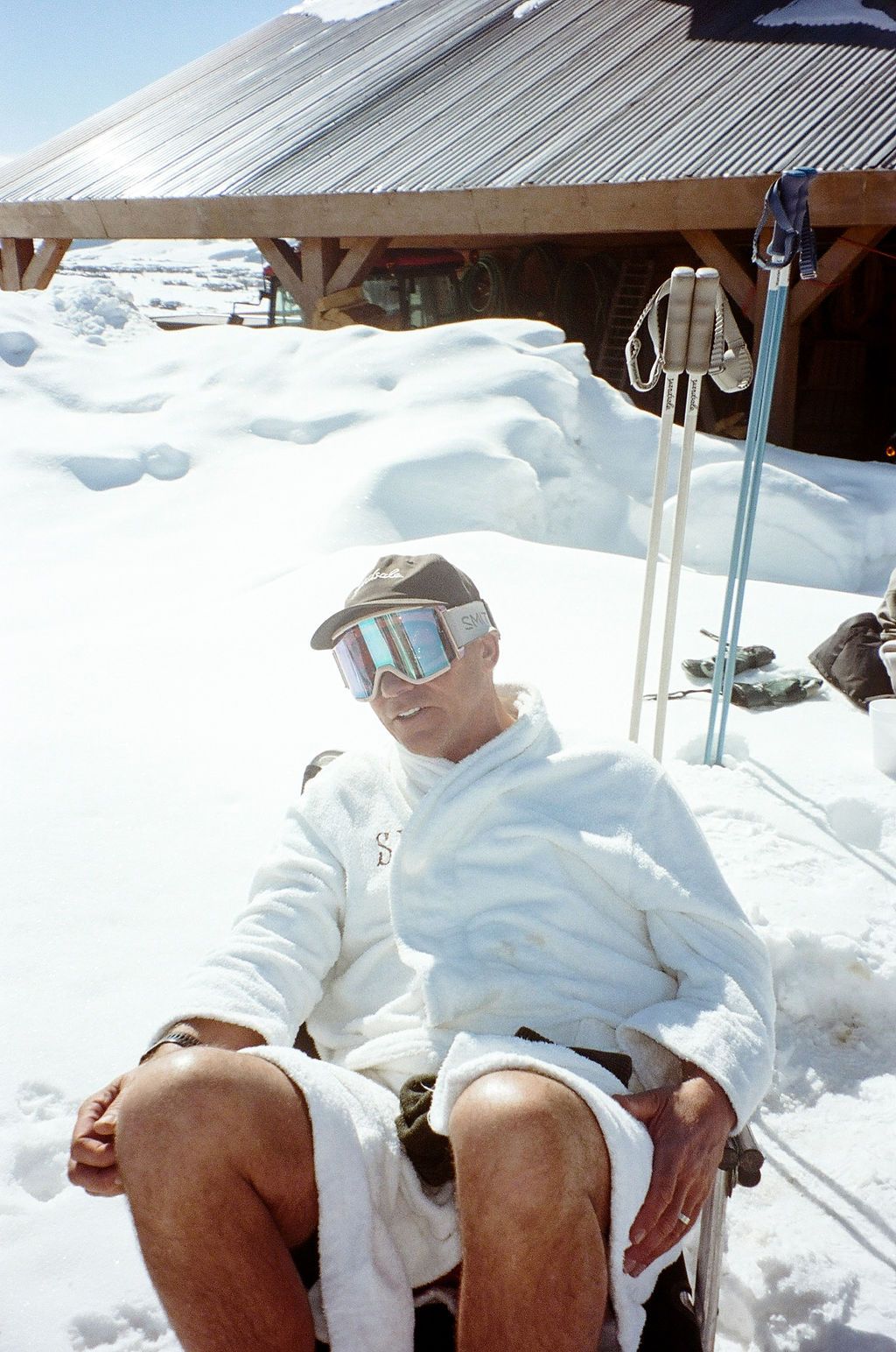 An image of a man in a chair in the snow