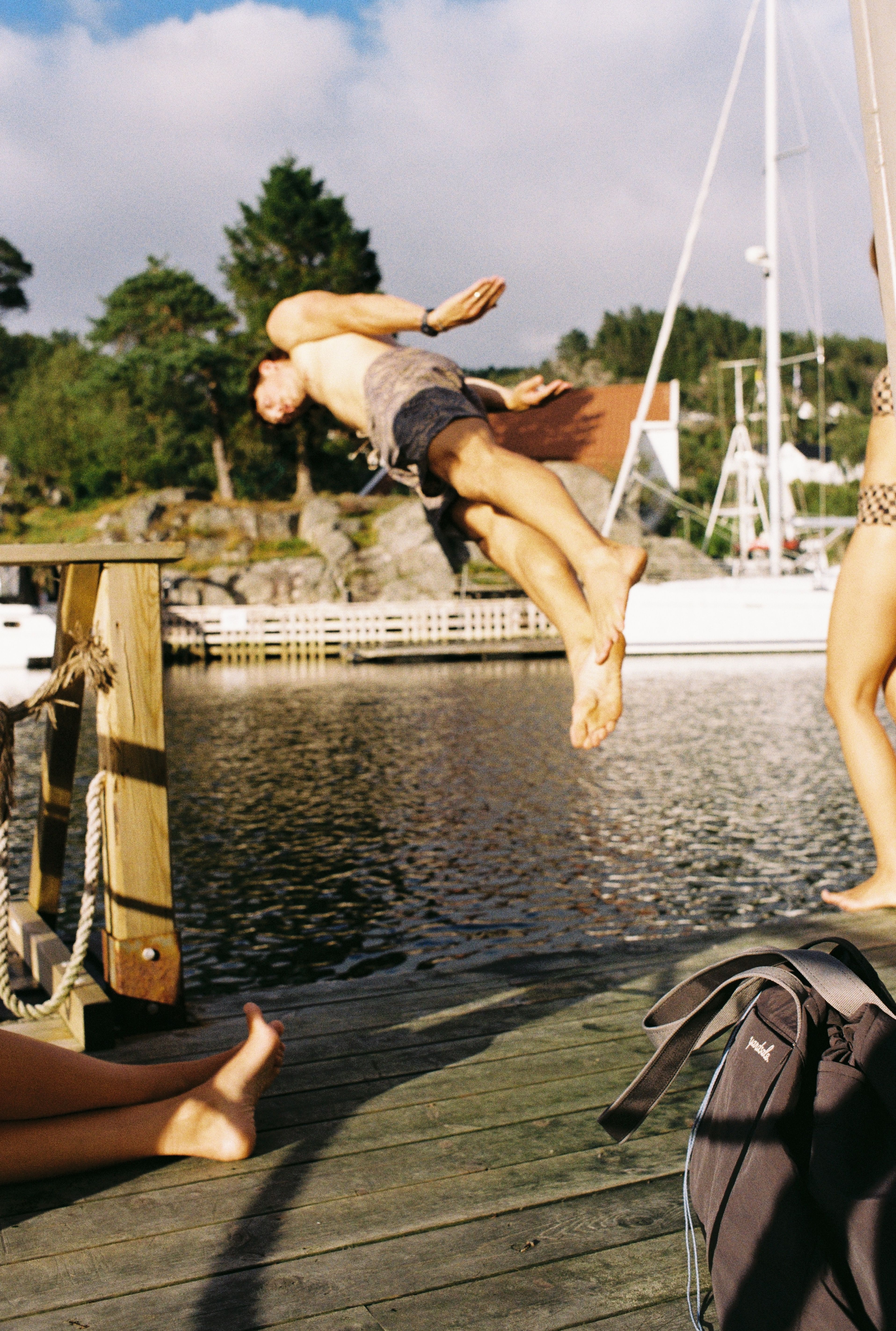 Image of a person jumping off a dock