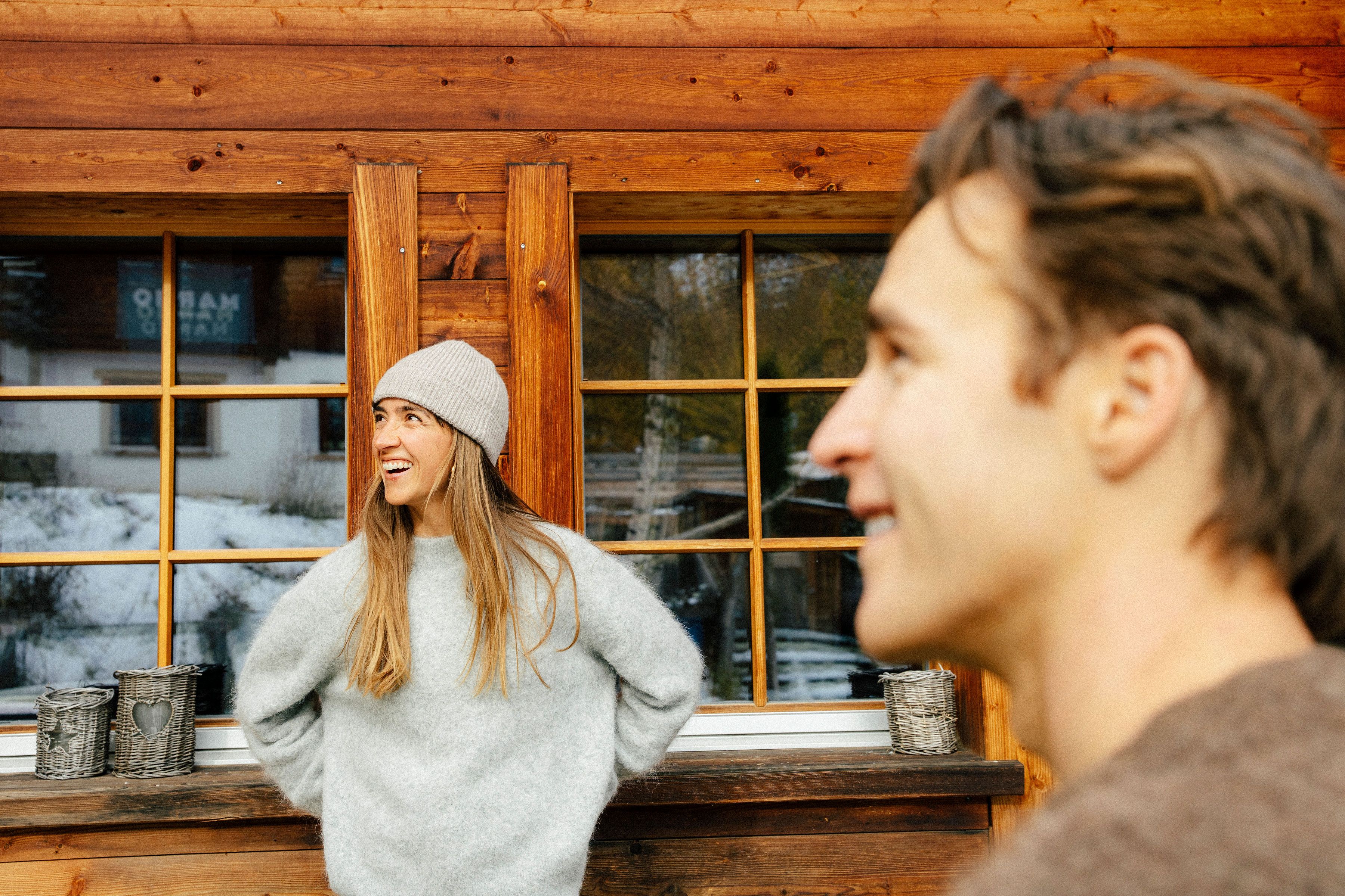 Image of group on porch wearing beanie