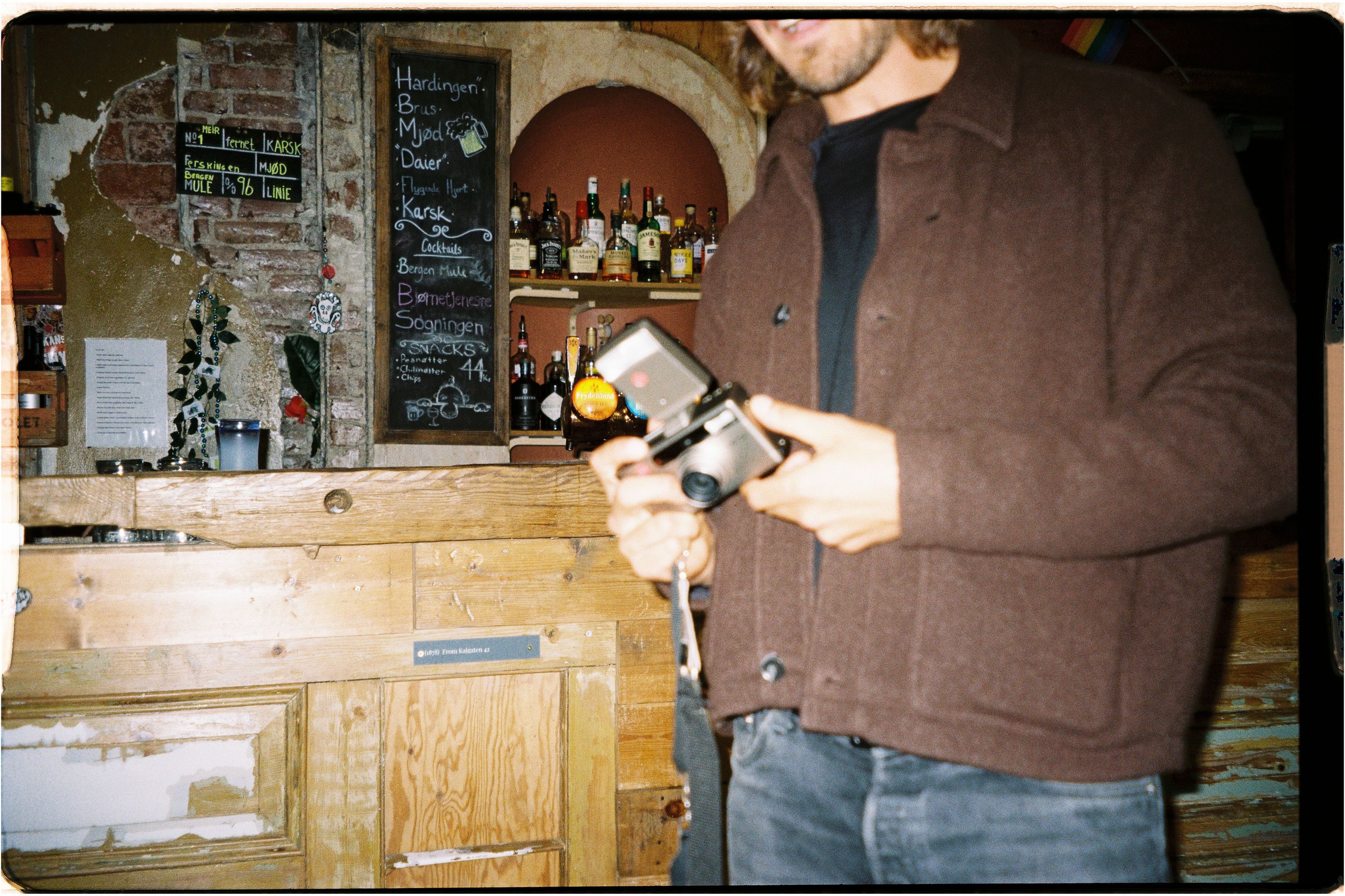 An image of someone with a film camera