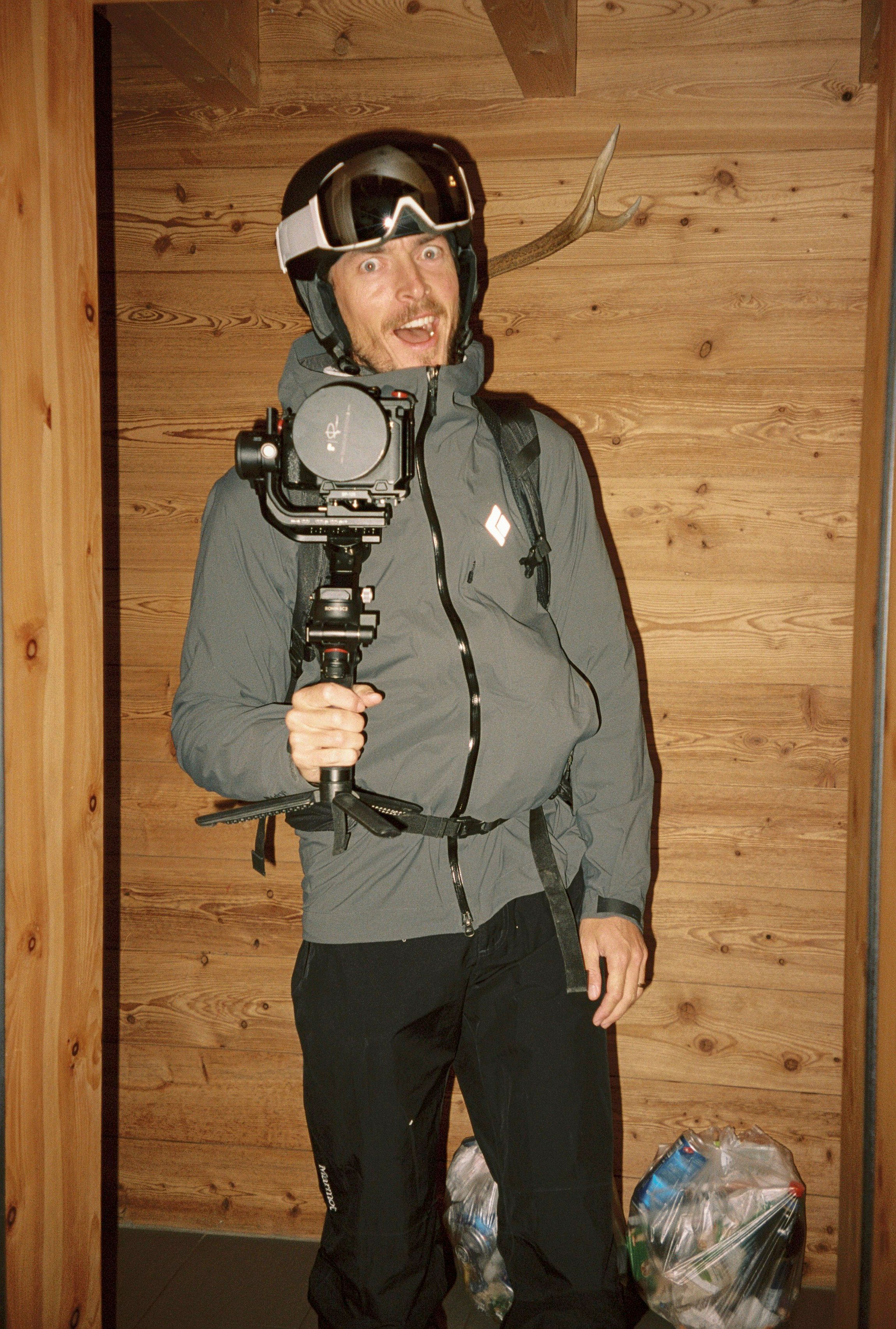 Image of a man with a camera in ski gear