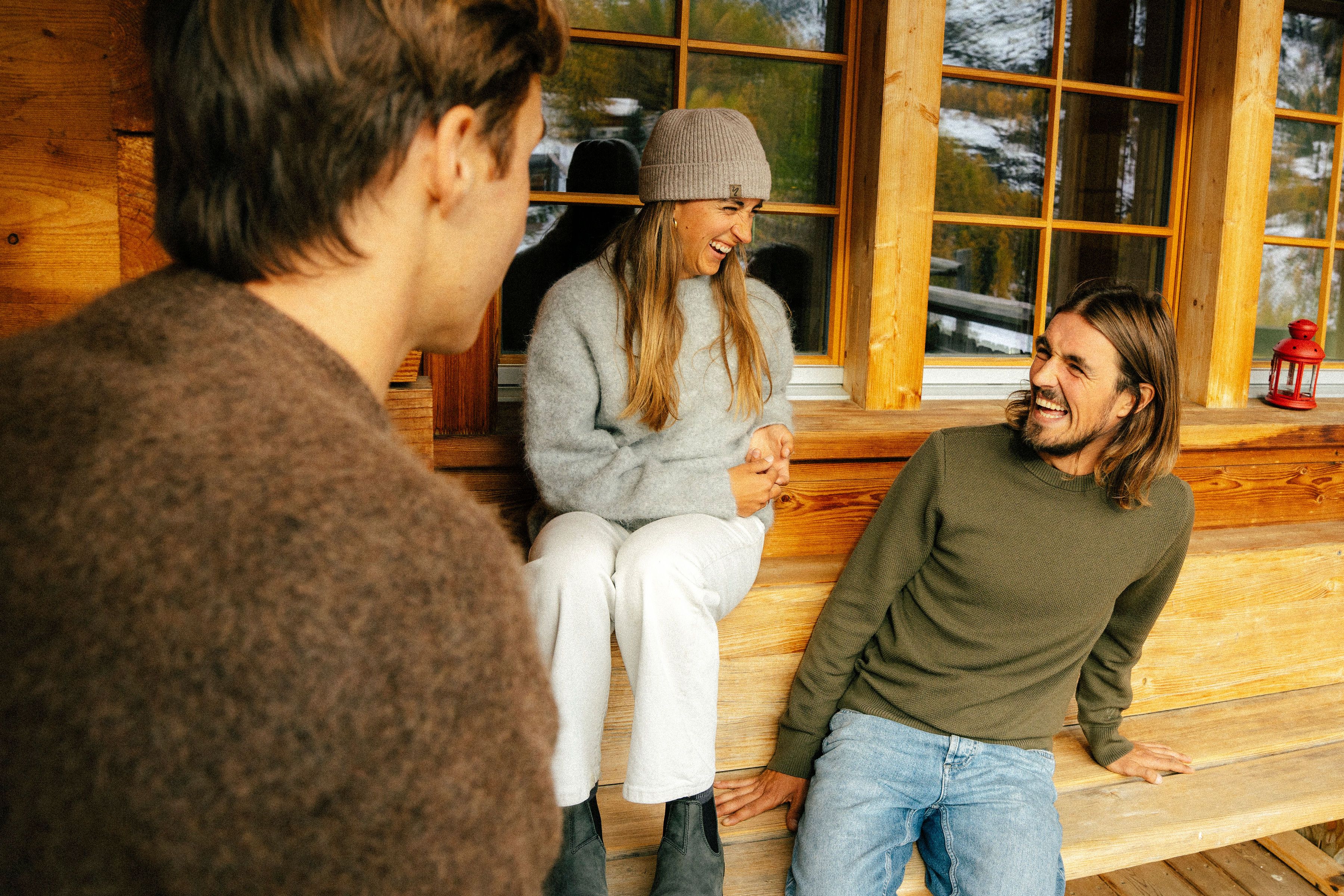 An image of a group of people lounging in a Dinner Sweater