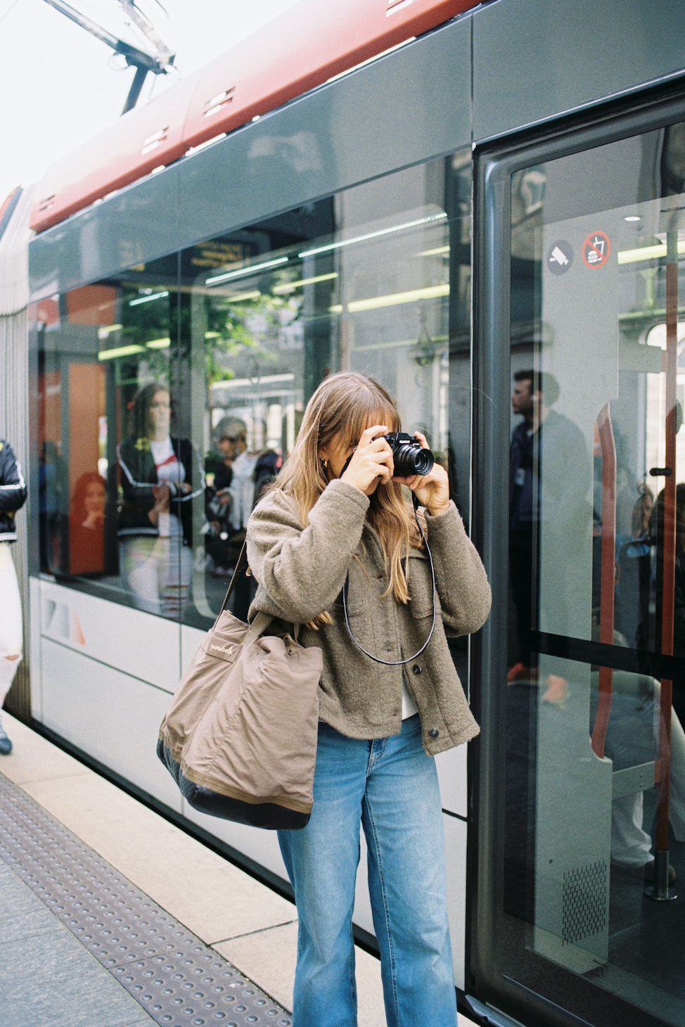 An image of a person waiting for a train