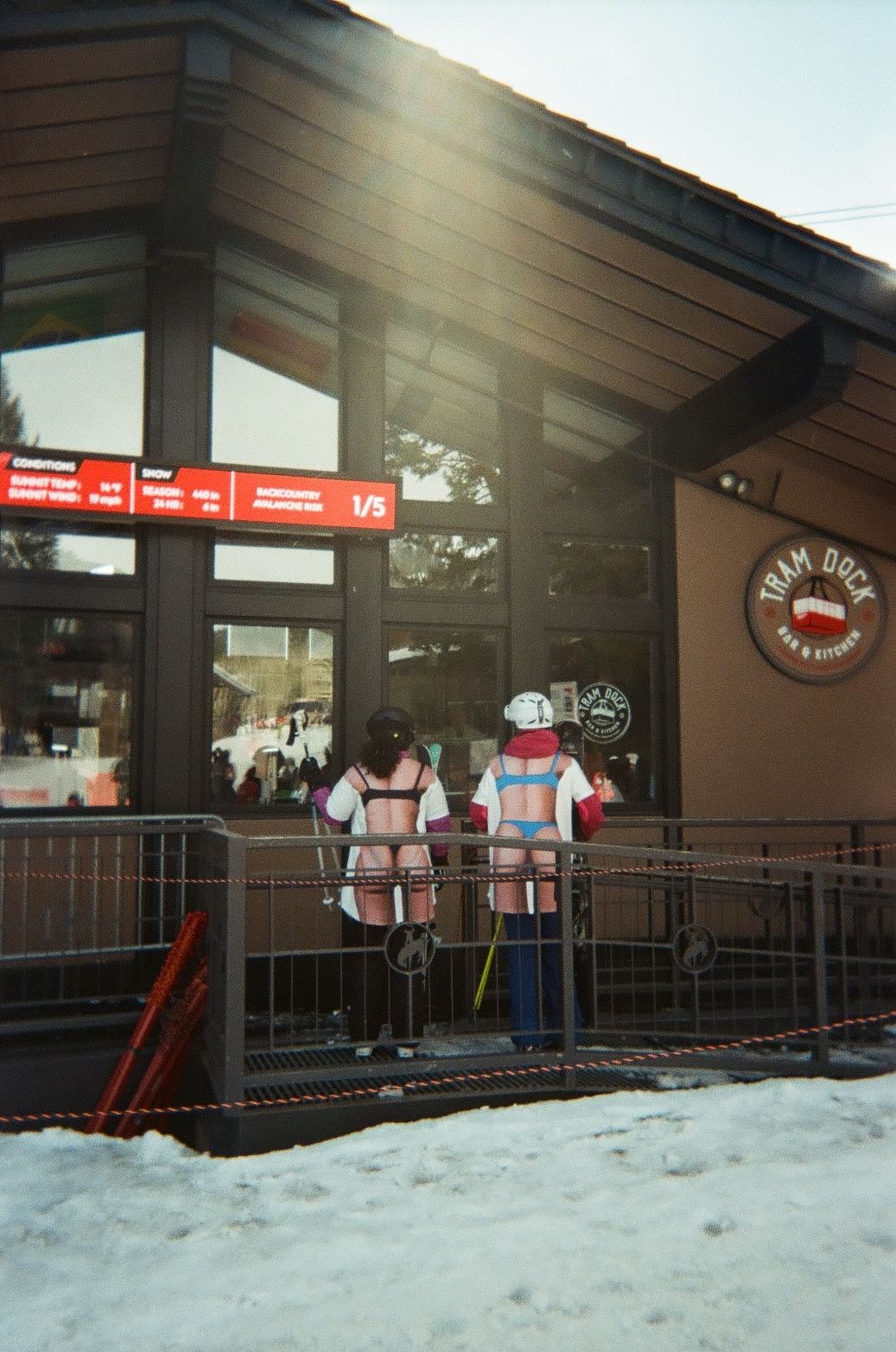 An image a of two people at a ski resort lodge