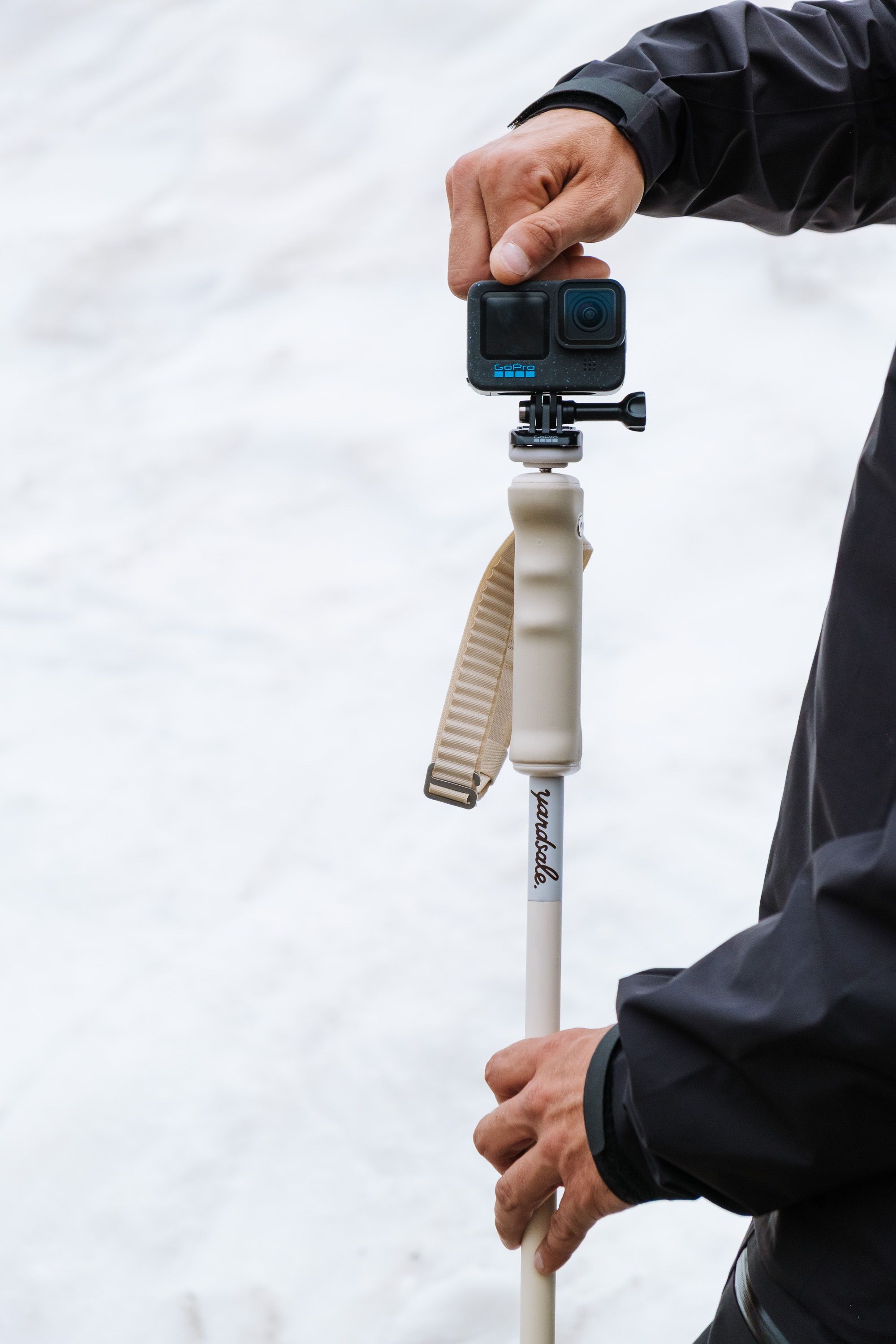 An image of skier screwing on a GoPro Mount
